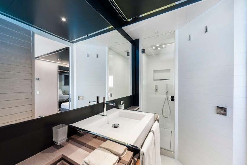 a bathroom with a sink and a mirror aboard BARRACUDA III Yacht for Charter