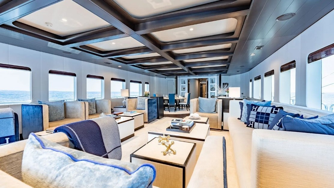 a room with a table and chairs aboard LOTUS Yacht for Charter