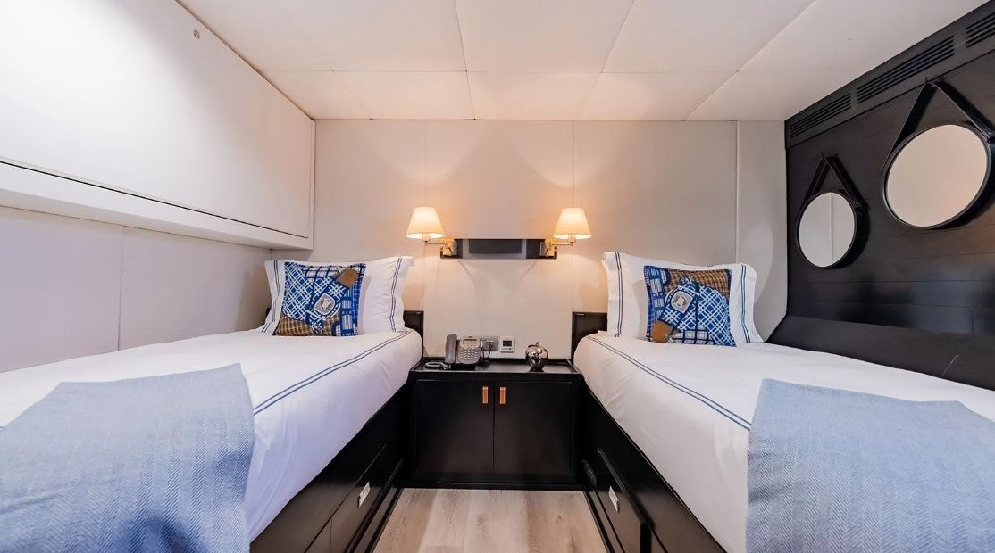 a room with two beds aboard LOTUS Yacht for Charter