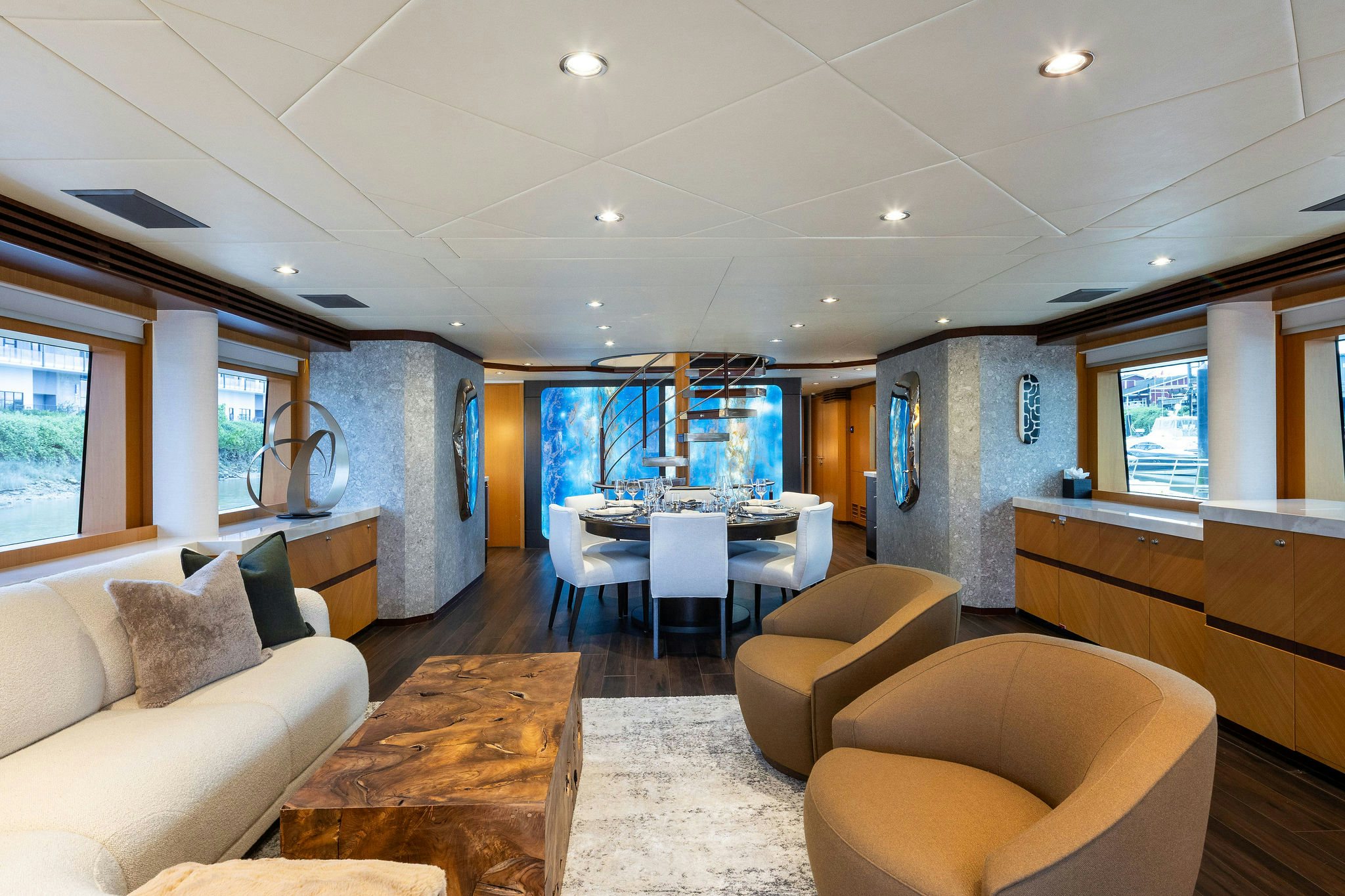 a living room with a table and chairs aboard LAST CALL Yacht for Charter