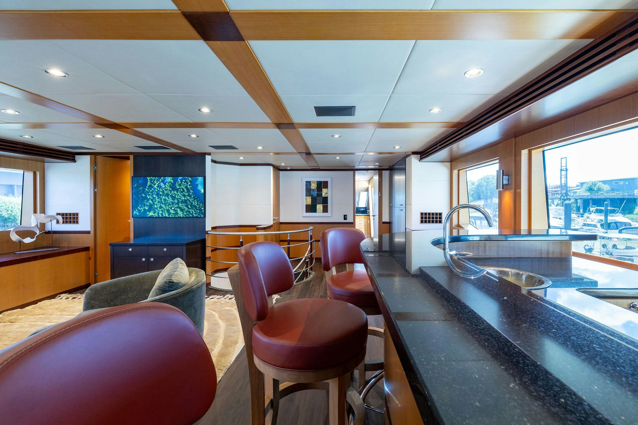 a large room with a table and chairs aboard LAST CALL Yacht for Charter