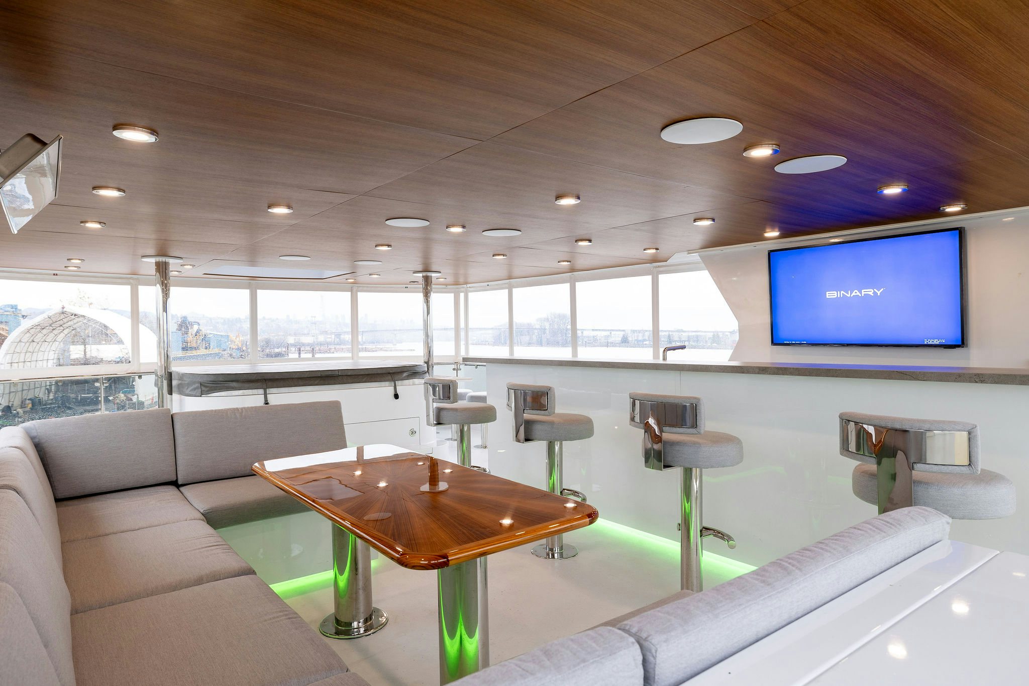 a room with a table and chairs aboard LAST CALL Yacht for Charter