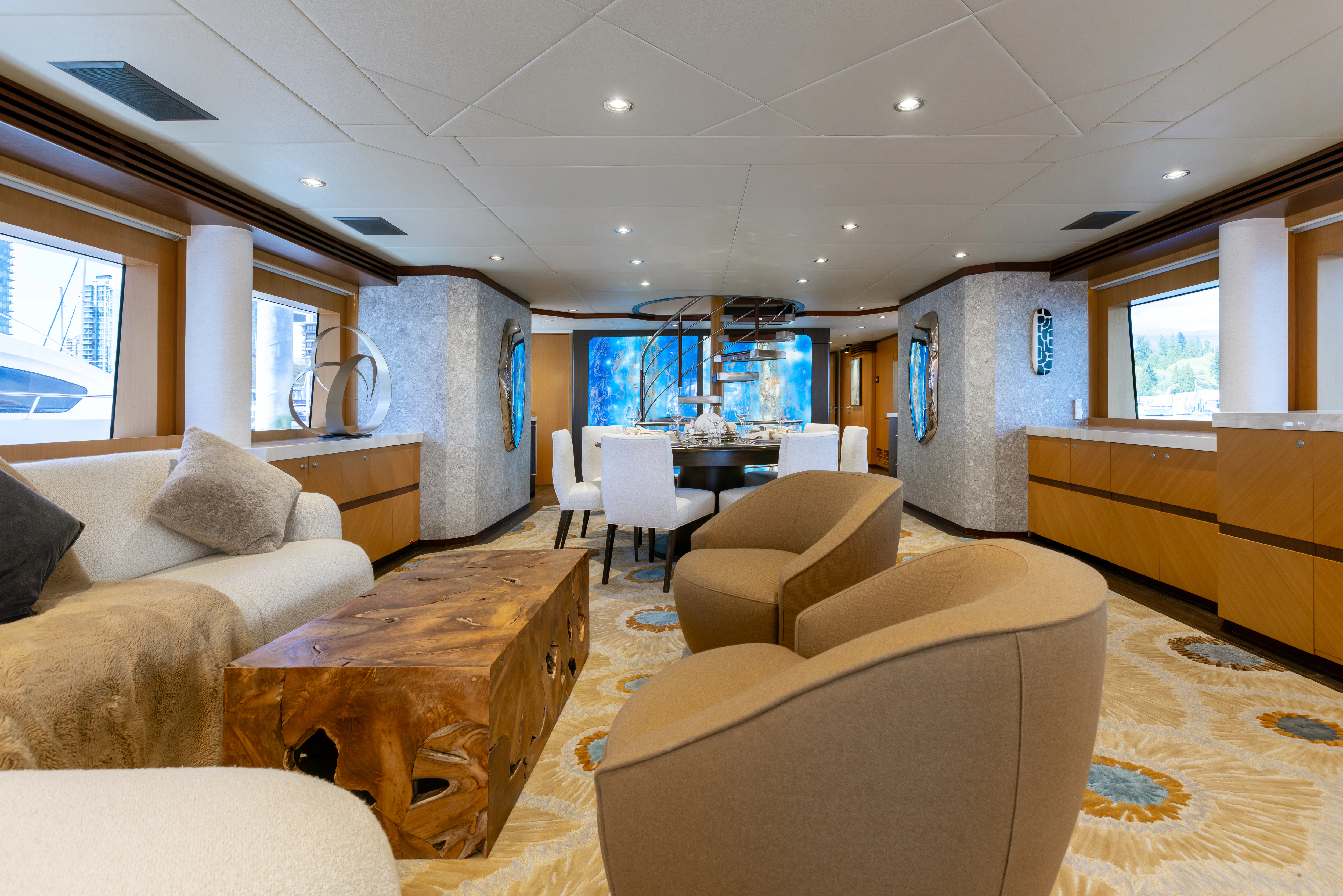 a living room with couches and a table aboard LAST CALL Yacht for Charter