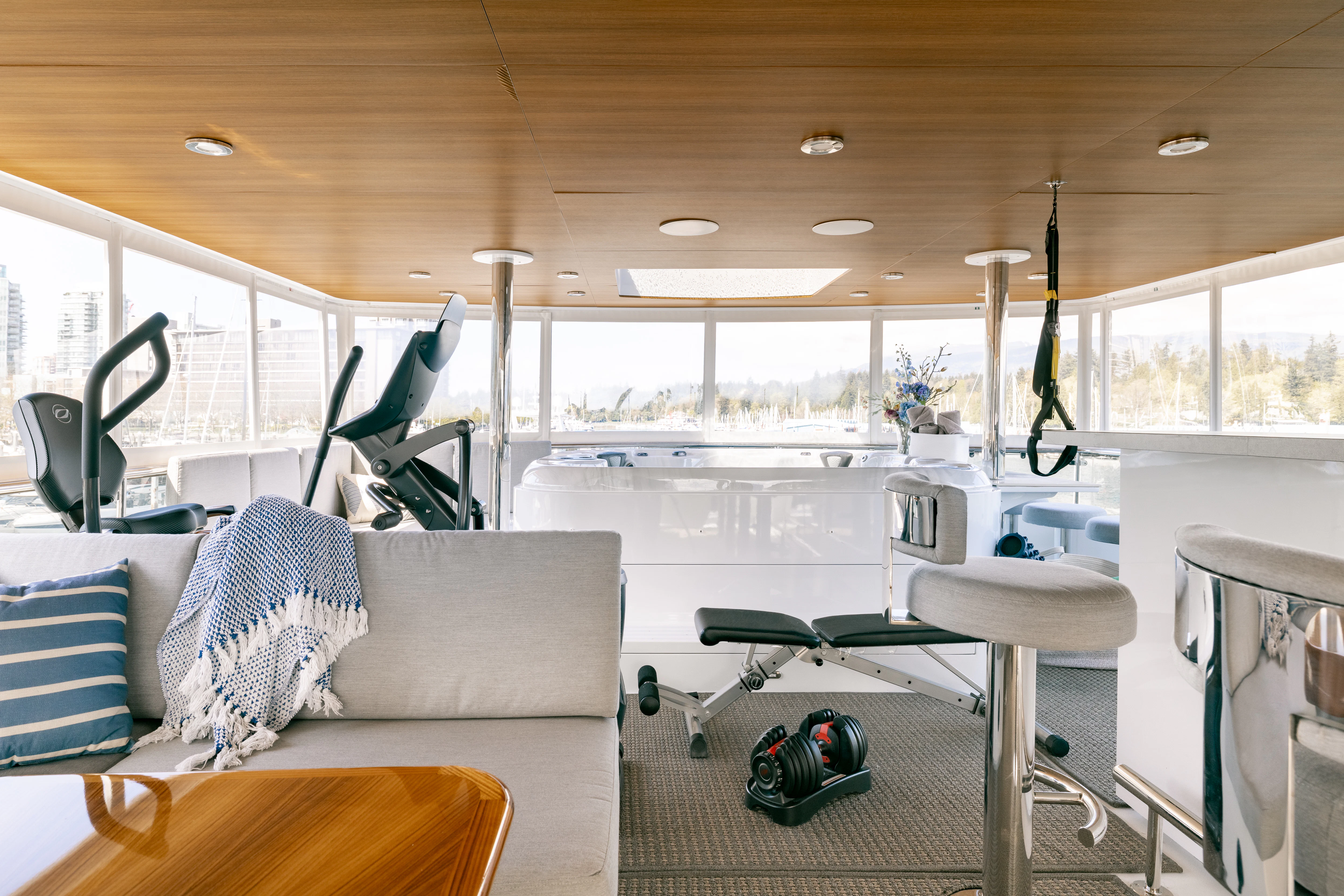 a room with a couch and a chair and a table aboard LAST CALL Yacht for Charter