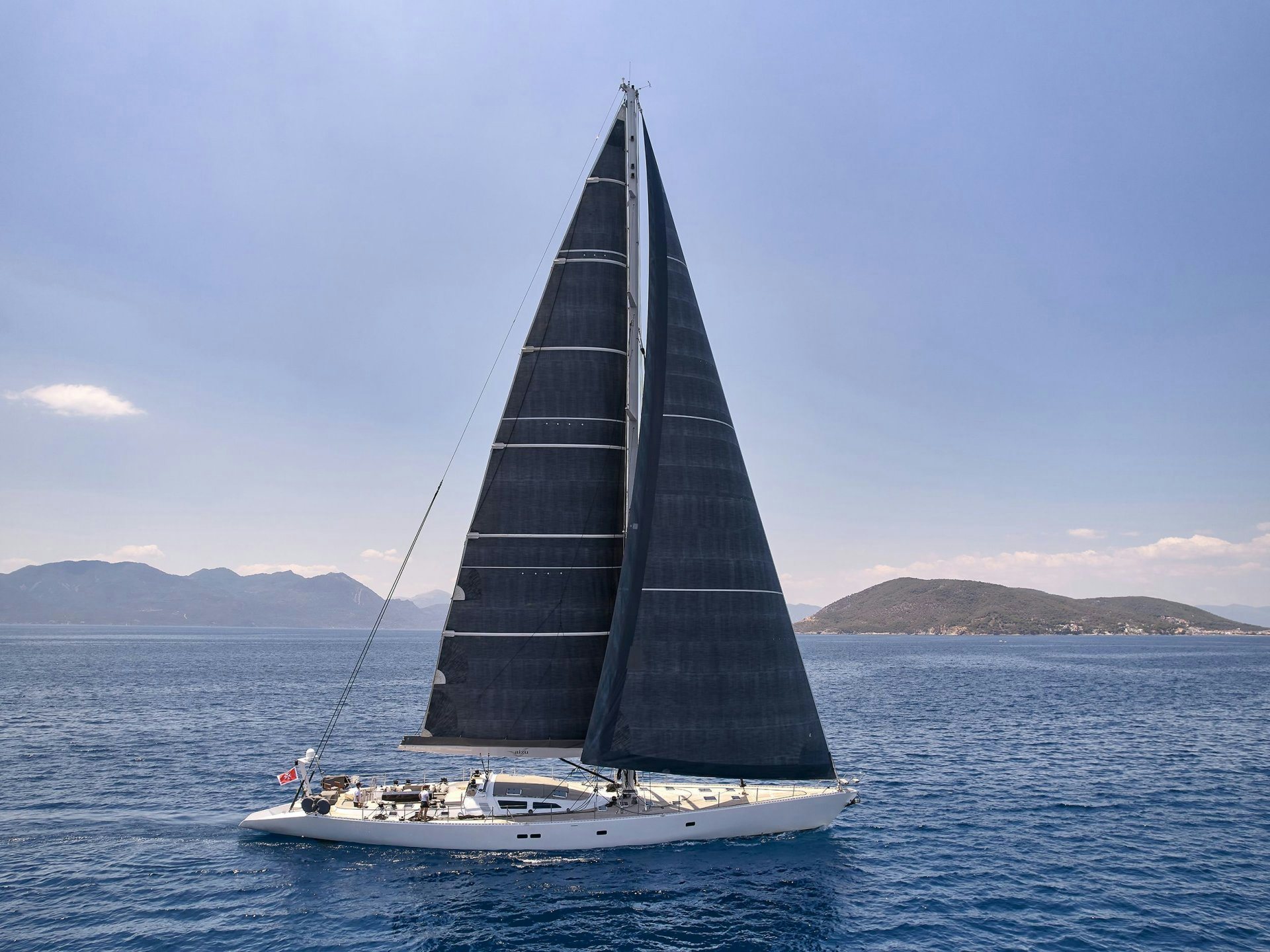 a sailboat on the water aboard AIZU Yacht for Sale