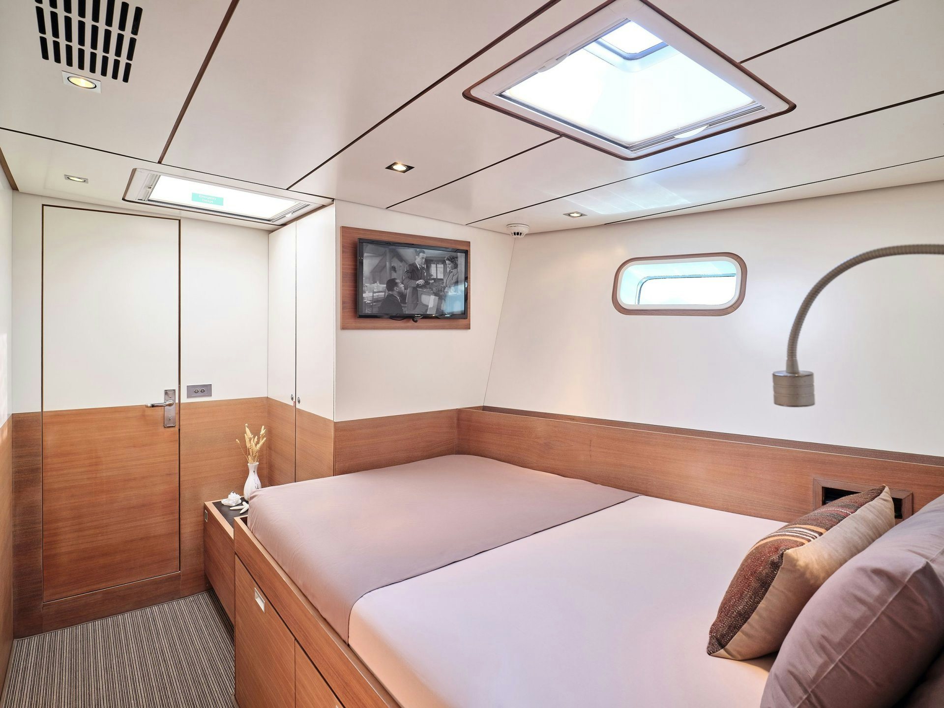 a room with a bed and a window aboard AIZU Yacht for Sale