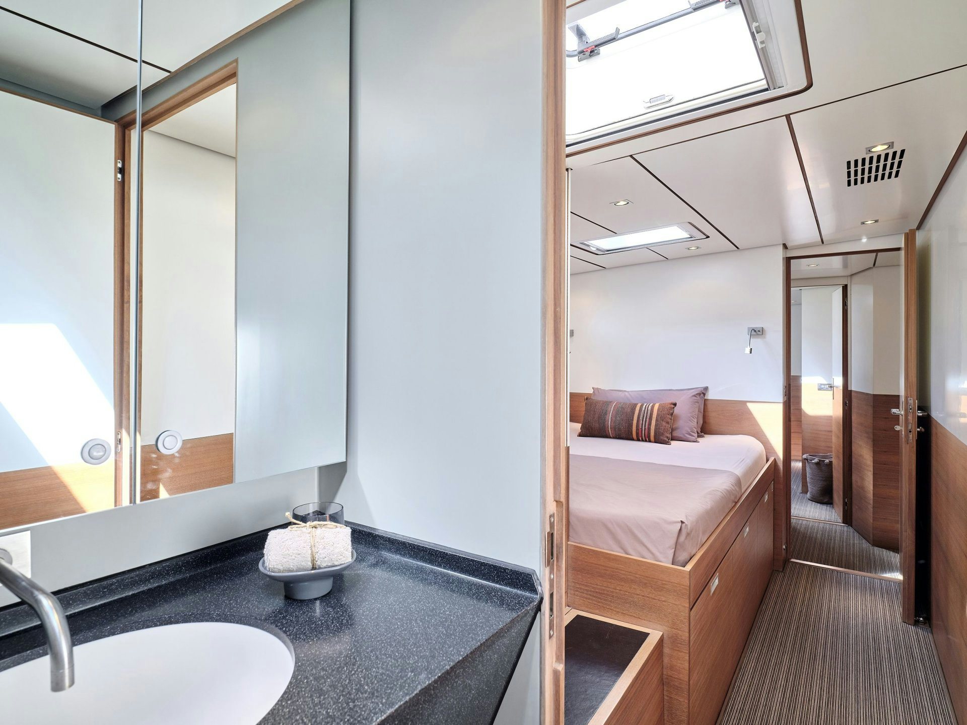 a bathroom with a large mirror aboard AIZU Yacht for Sale