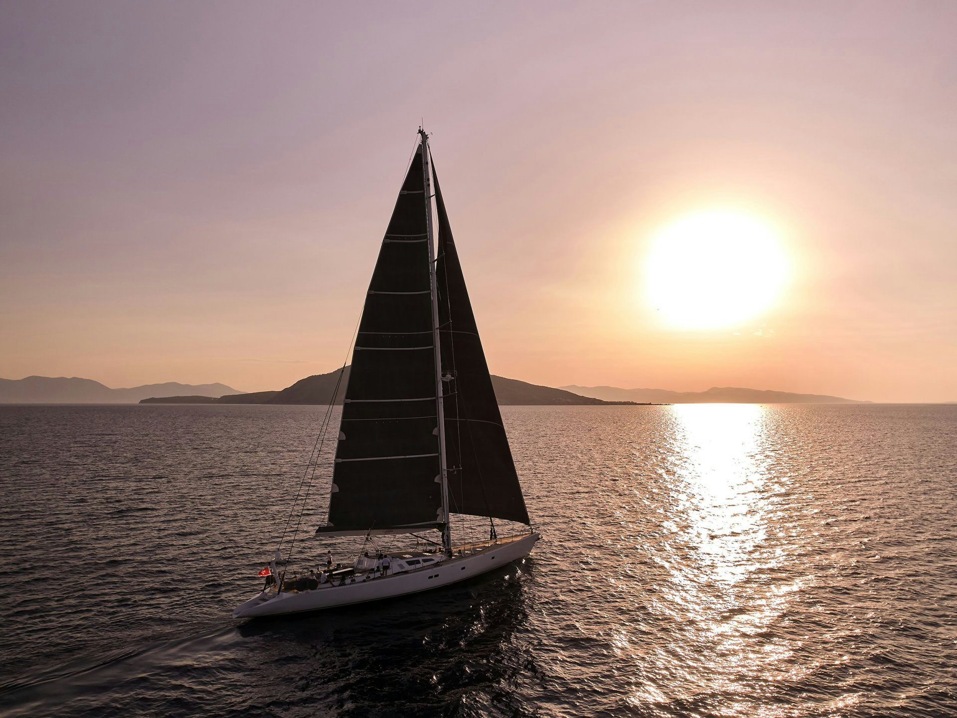 a sailboat on the water aboard AIZU Yacht for Sale