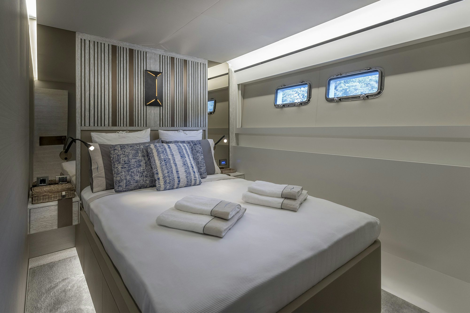a bed with a white bed spread aboard NUMARINE 26XP/25 Yacht for Sale