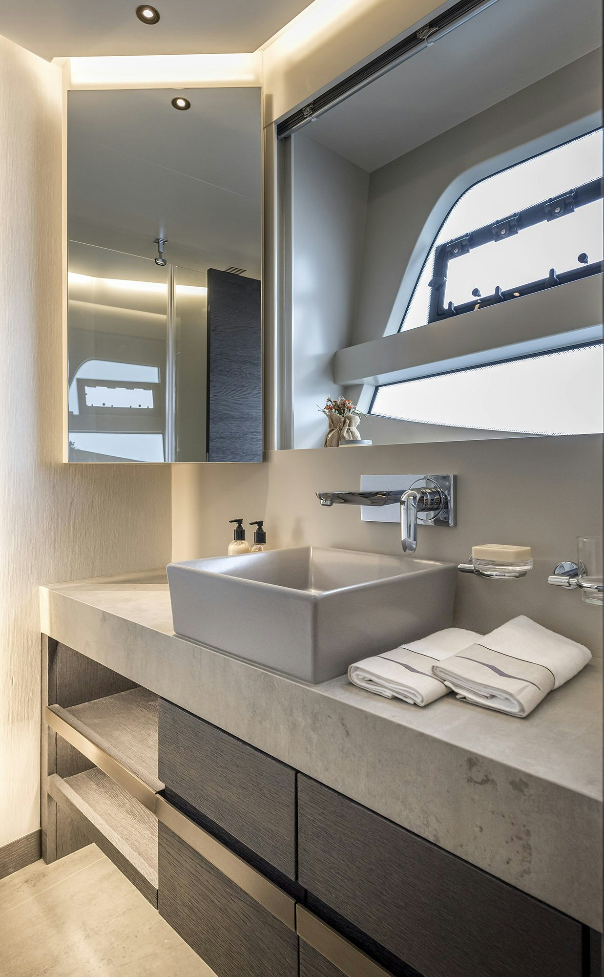 a bathroom with a large mirror aboard NUMARINE 26XP/25 Yacht for Sale