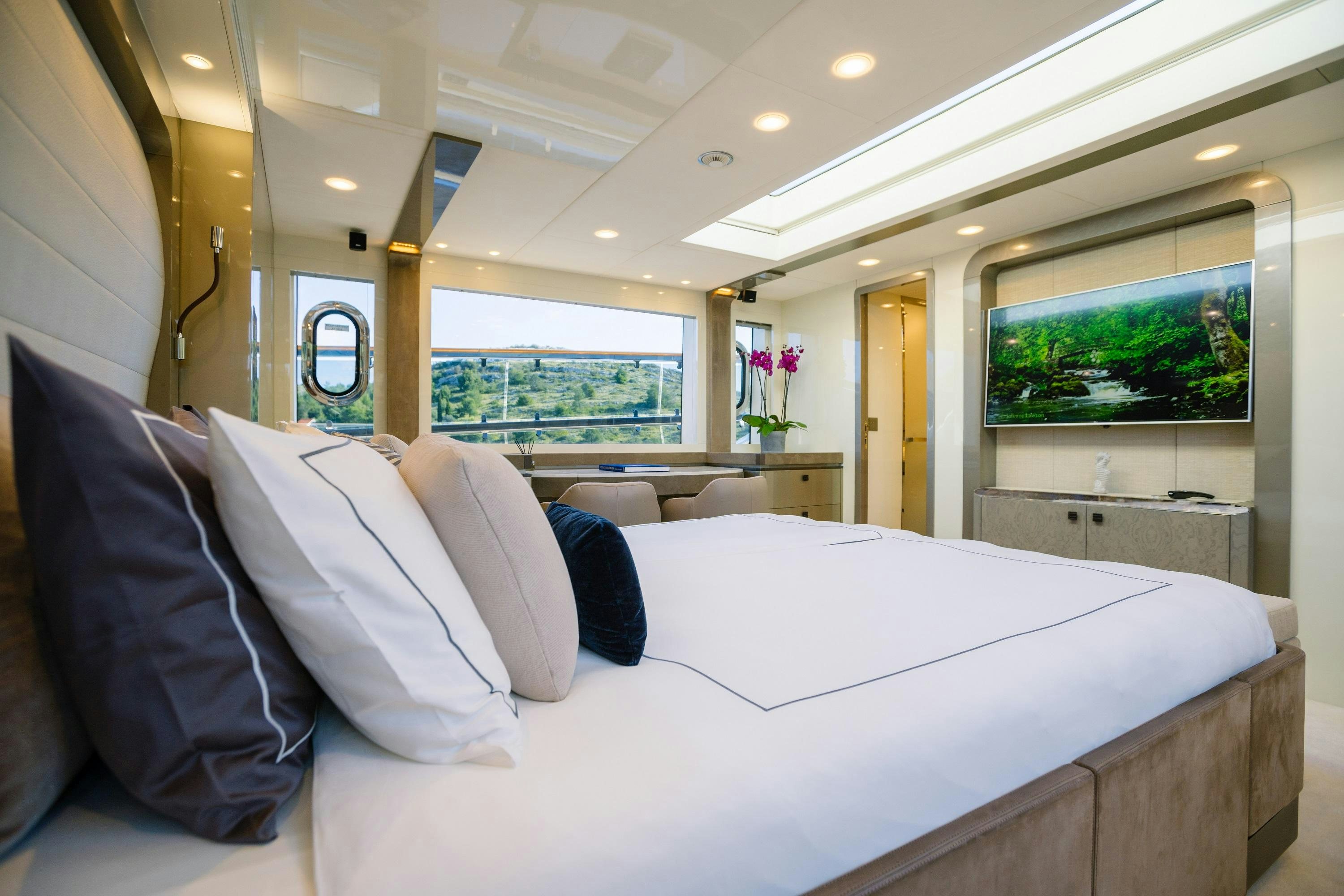 a white bed in a room aboard VIVALDI Yacht for Charter