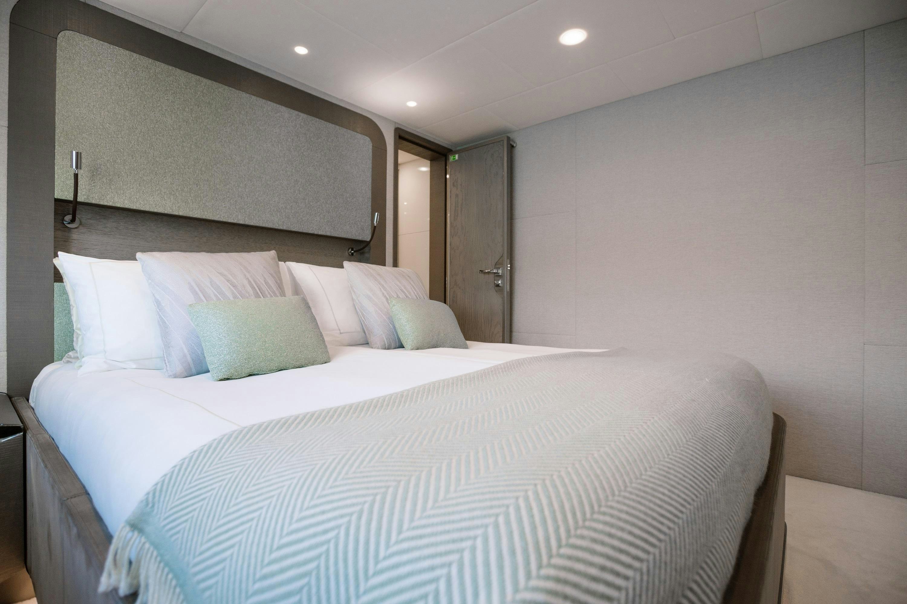a bed with white sheets aboard VIVALDI Yacht for Charter