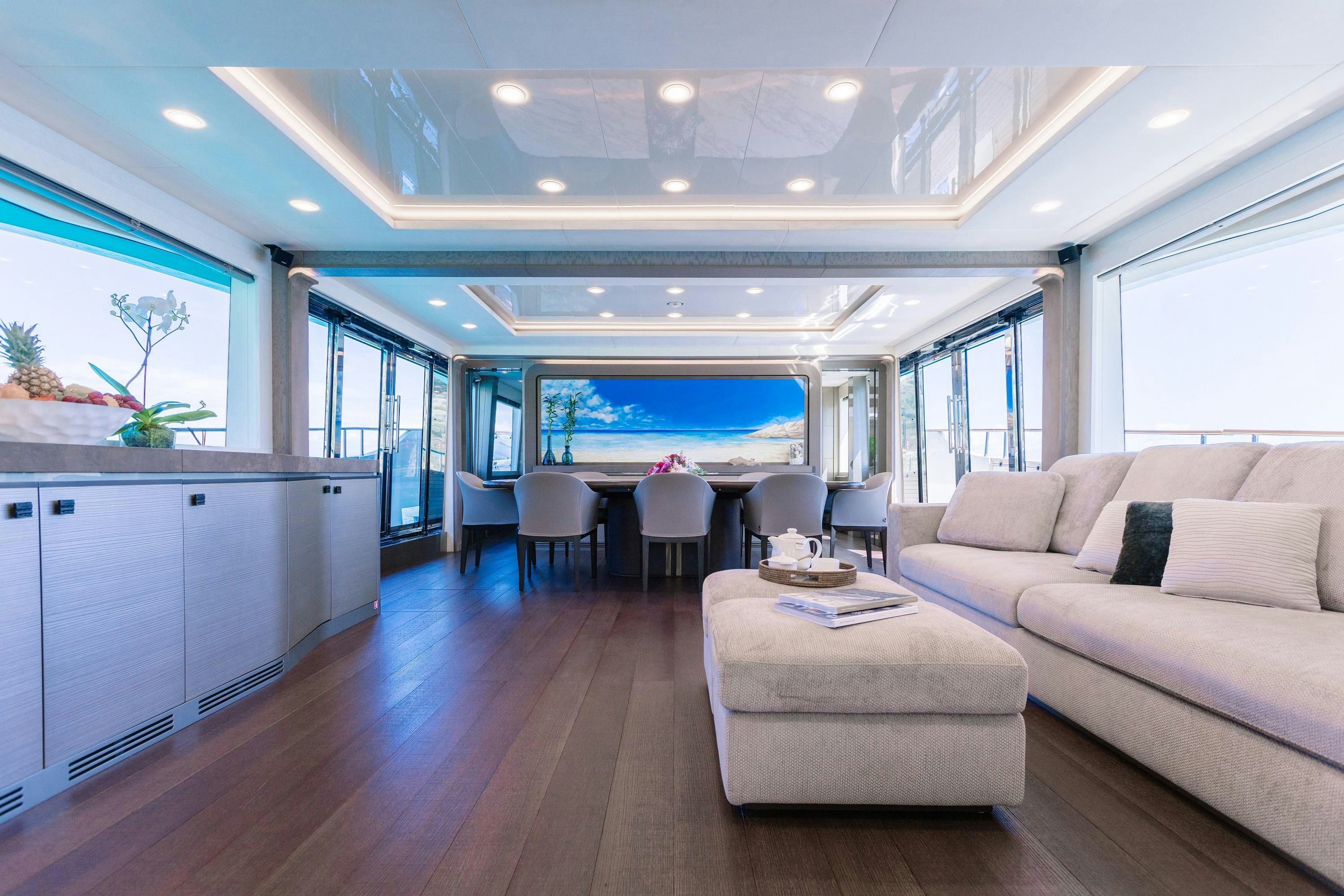 a living room with a large window aboard VIVALDI Yacht for Charter