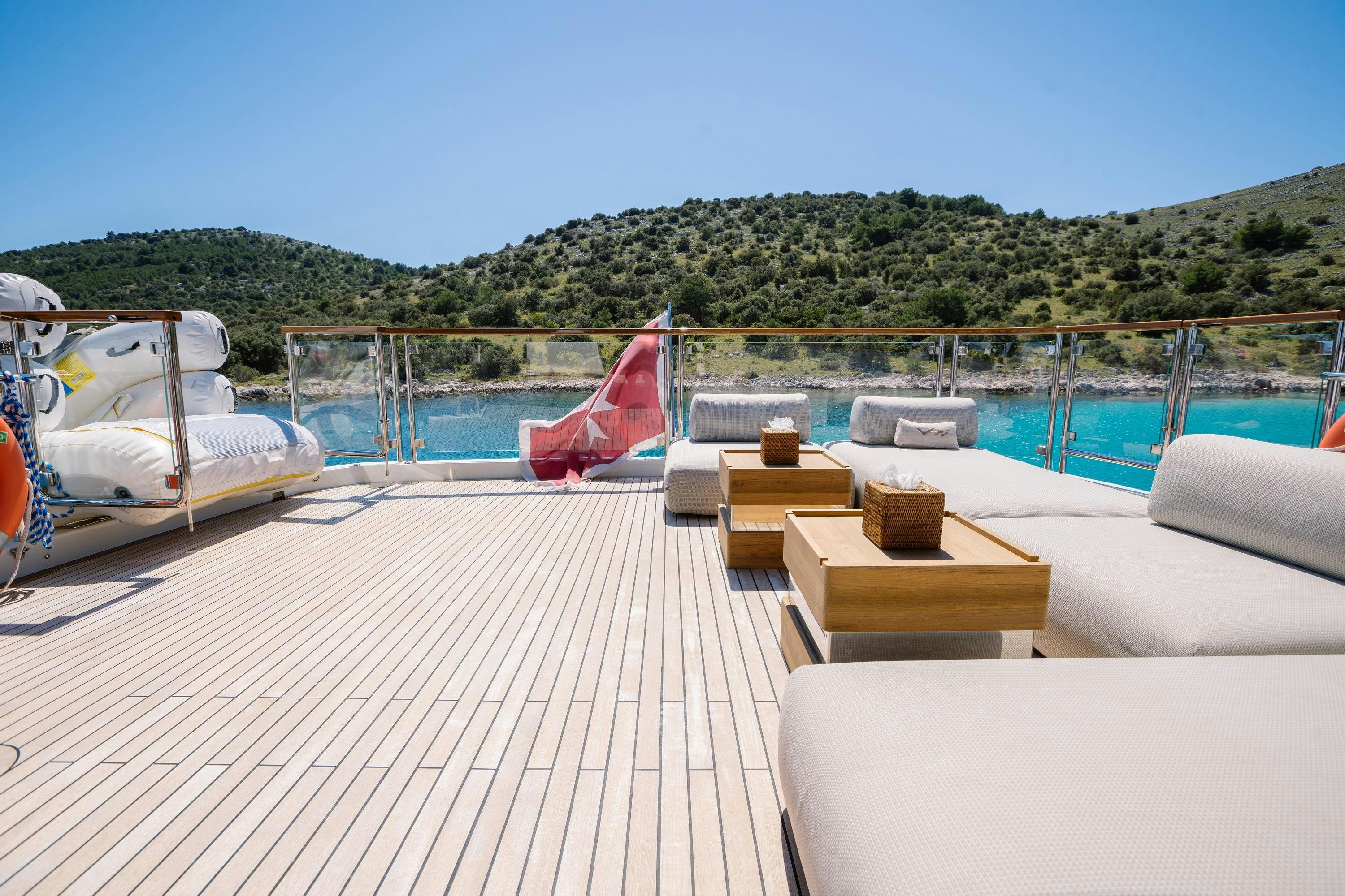 a deck with chairs and a pool aboard VIVALDI Yacht for Charter