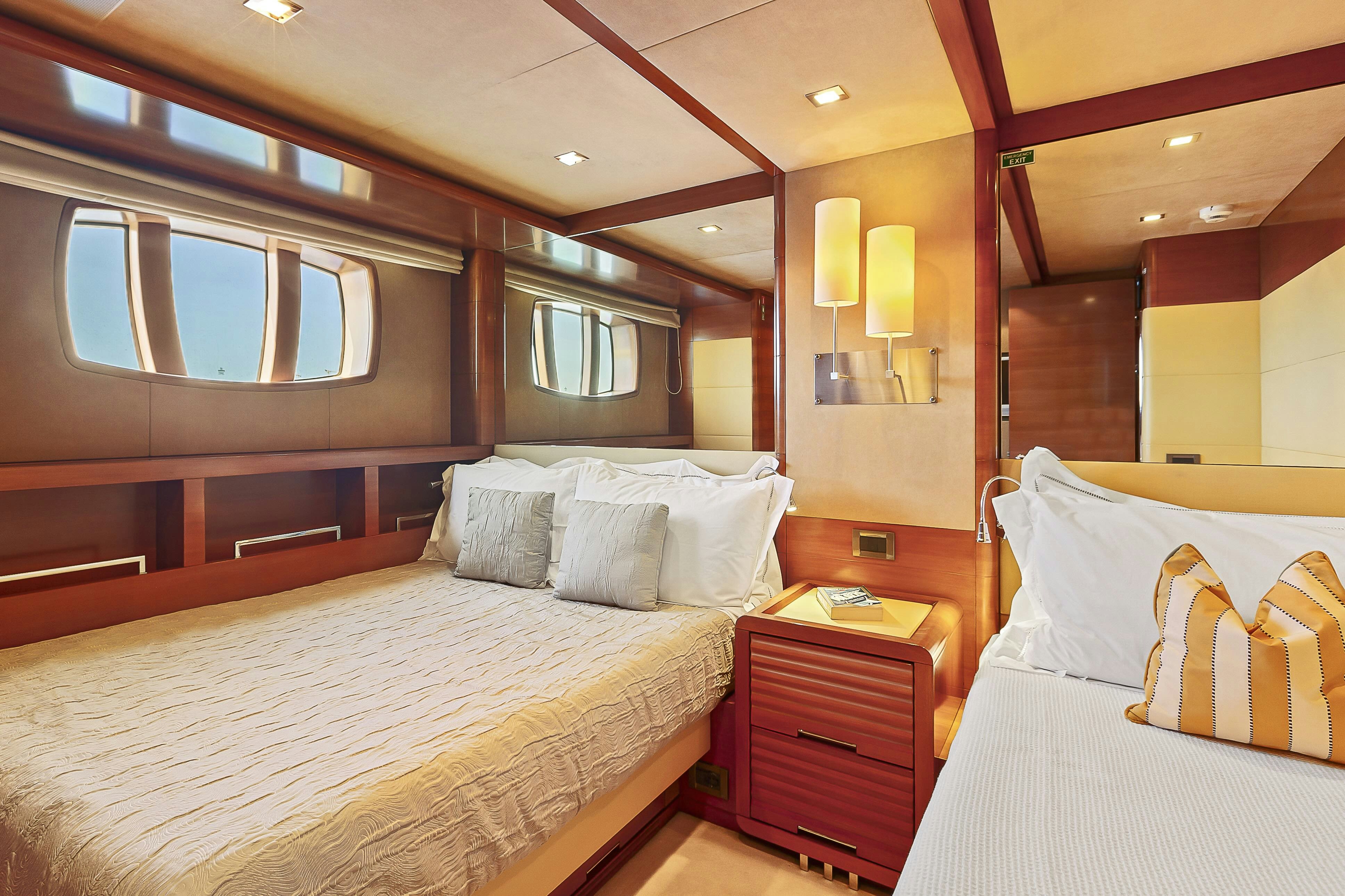 a room with two beds aboard ROSE OF KINGSTON II Yacht for Sale