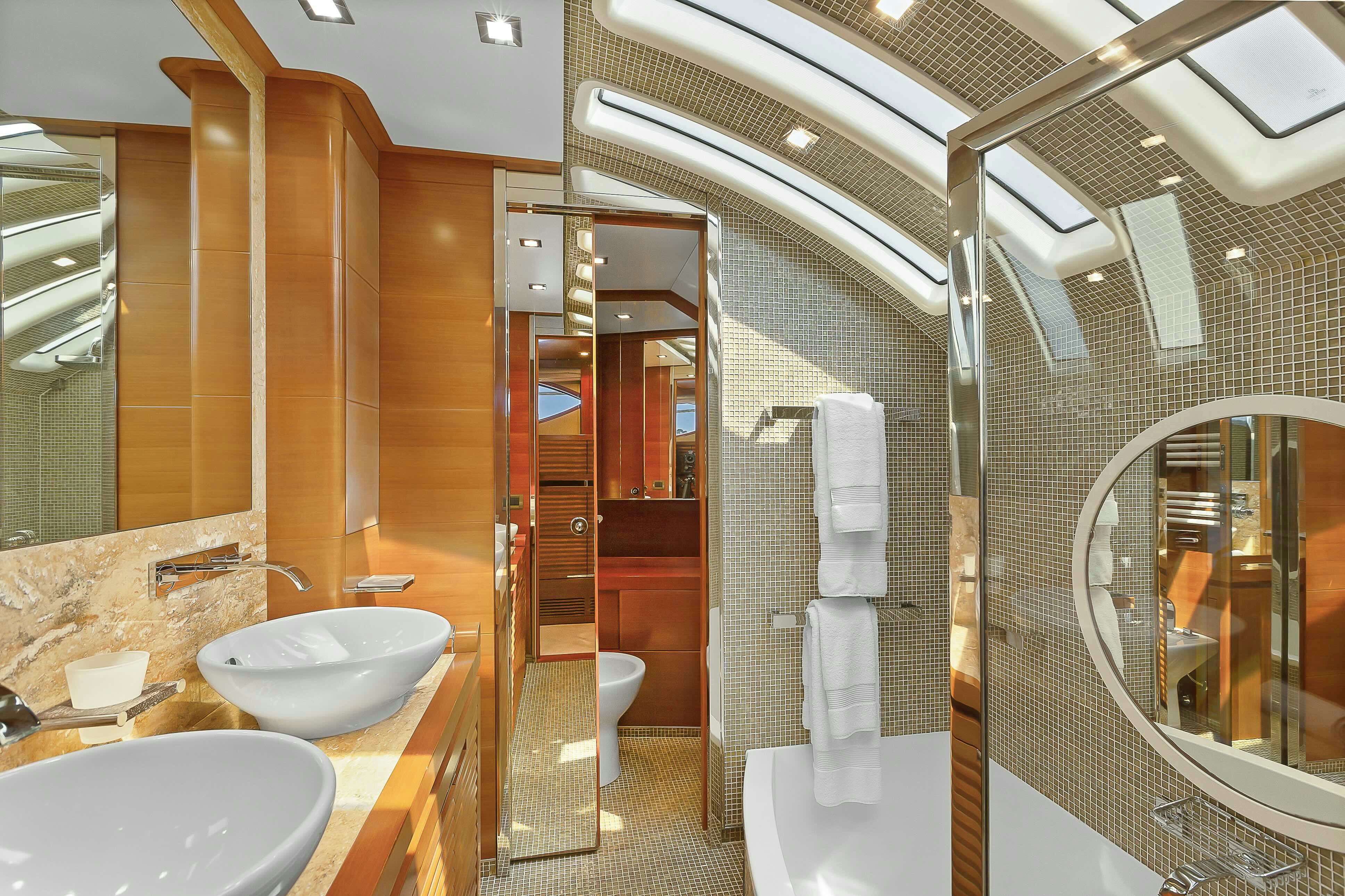 a bathroom with a glass shower aboard ROSE OF KINGSTON II Yacht for Sale