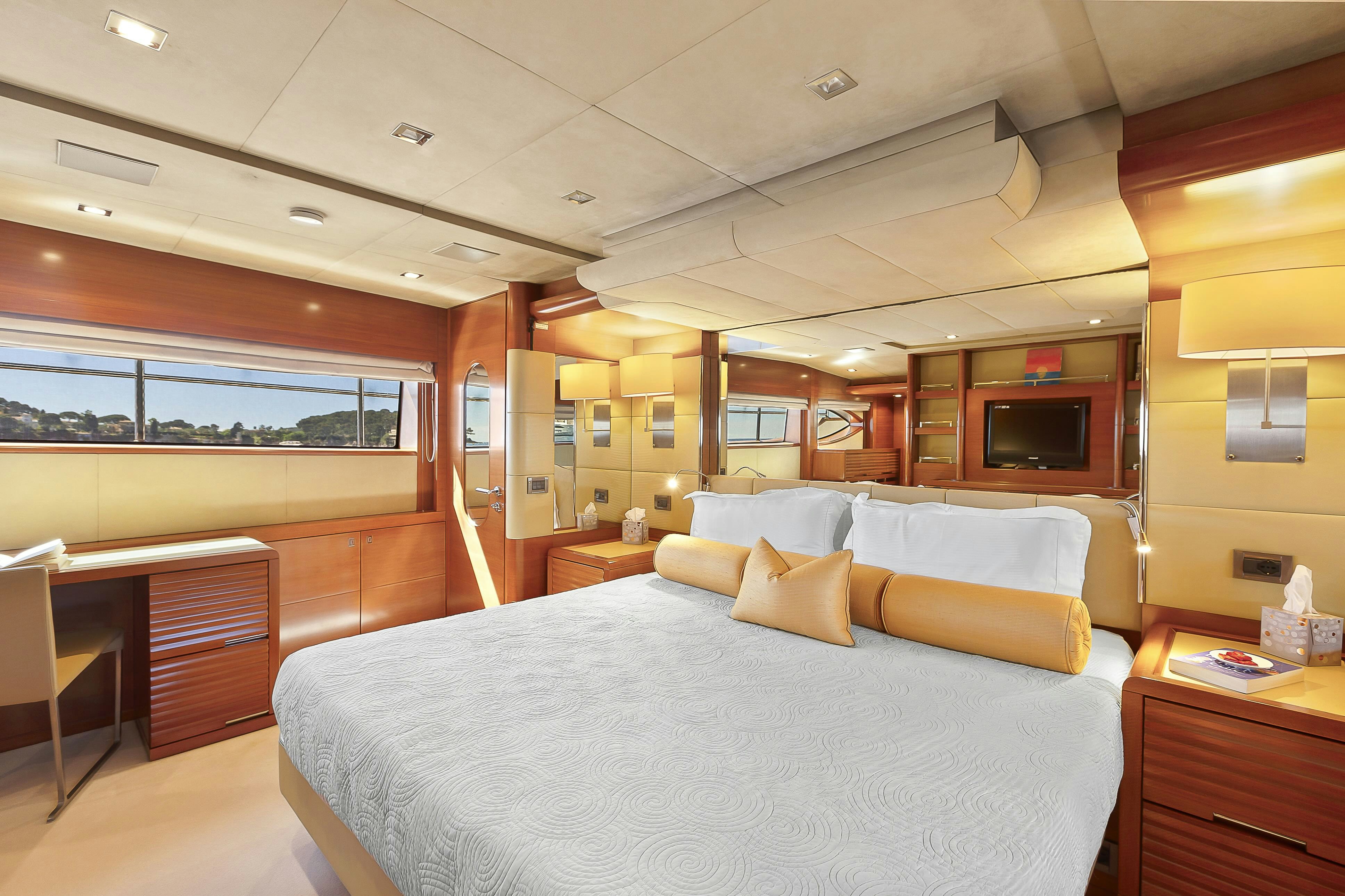 a large bed in a room aboard ROSE OF KINGSTON II Yacht for Sale
