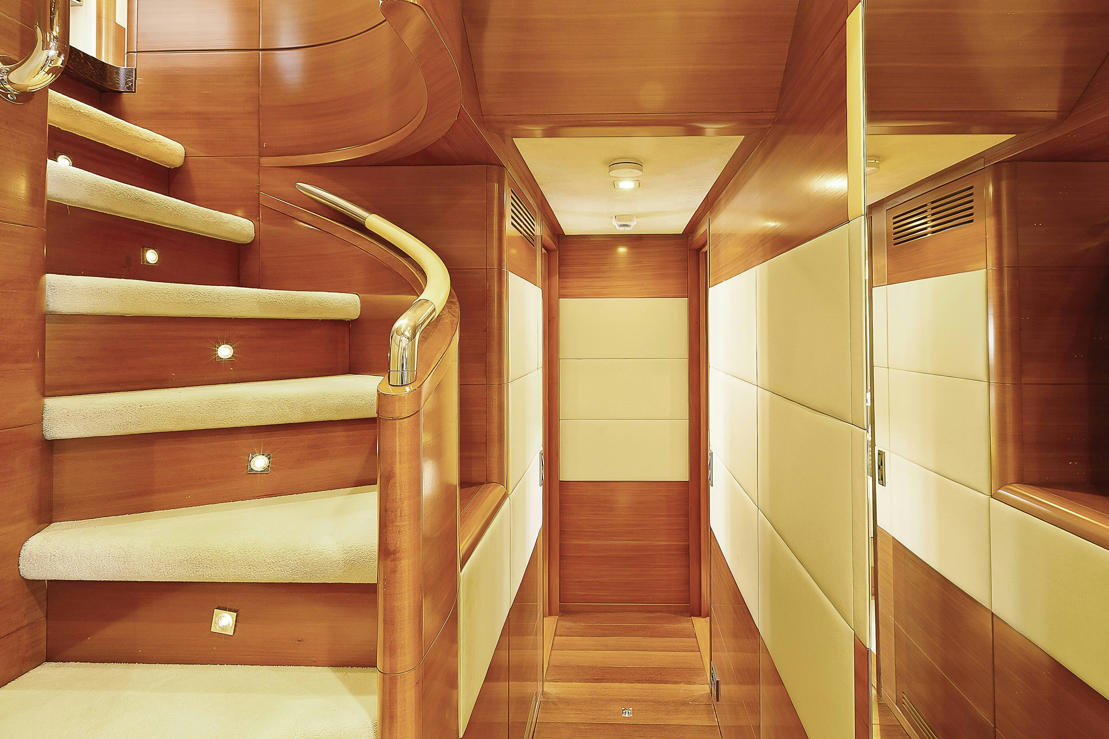 a wooden staircase in a room aboard ROSE OF KINGSTON II Yacht for Sale