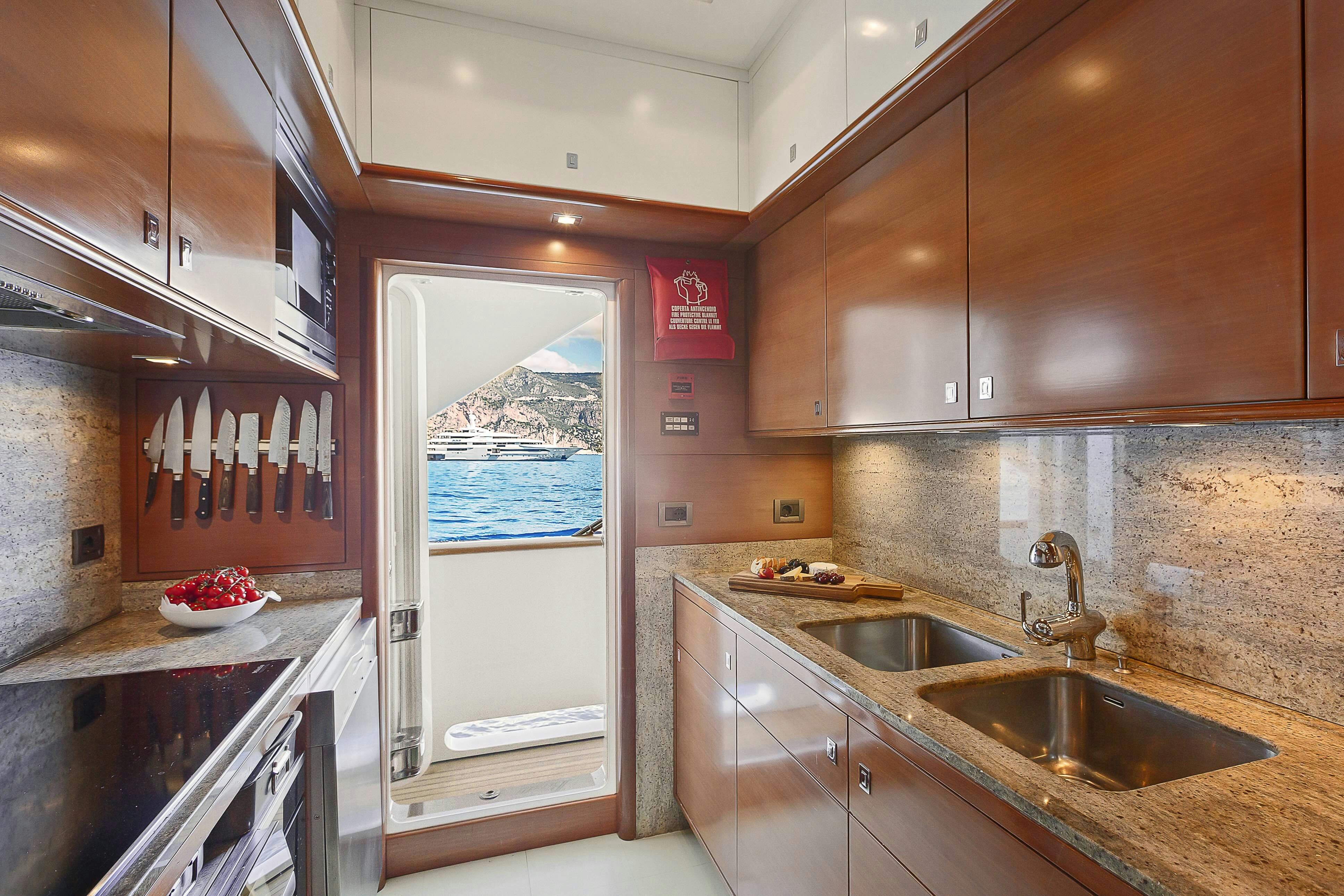 a kitchen with a glass door aboard ROSE OF KINGSTON II Yacht for Sale