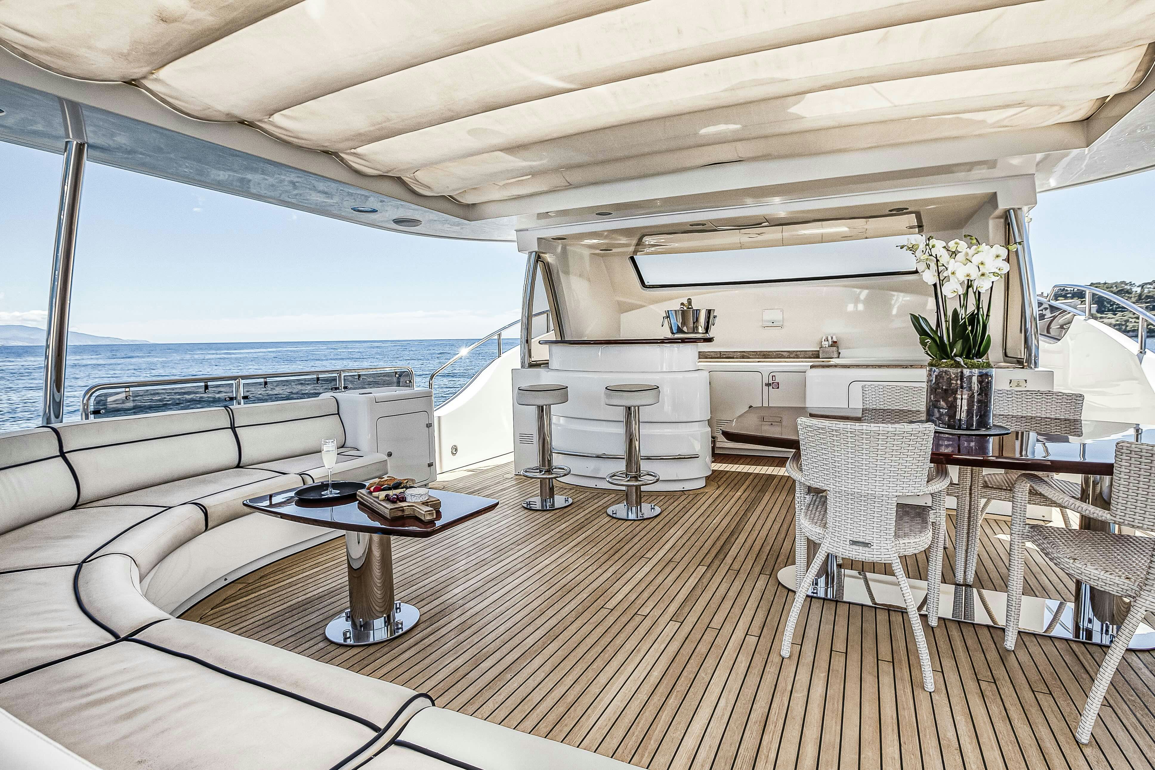 a large living room with a large balcony aboard ROSE OF KINGSTON II Yacht for Sale