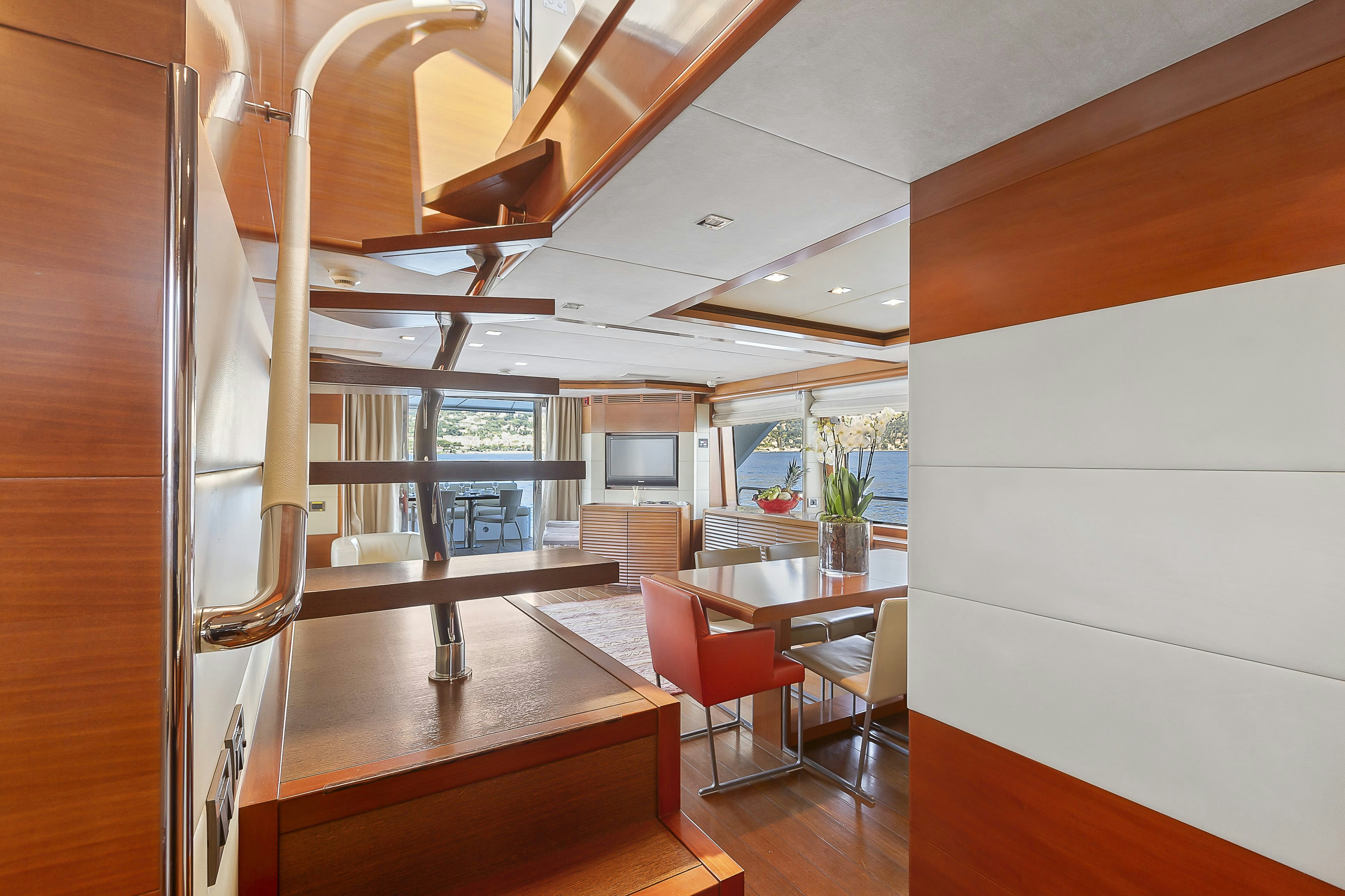 a room with a table and chairs aboard ROSE OF KINGSTON II Yacht for Sale