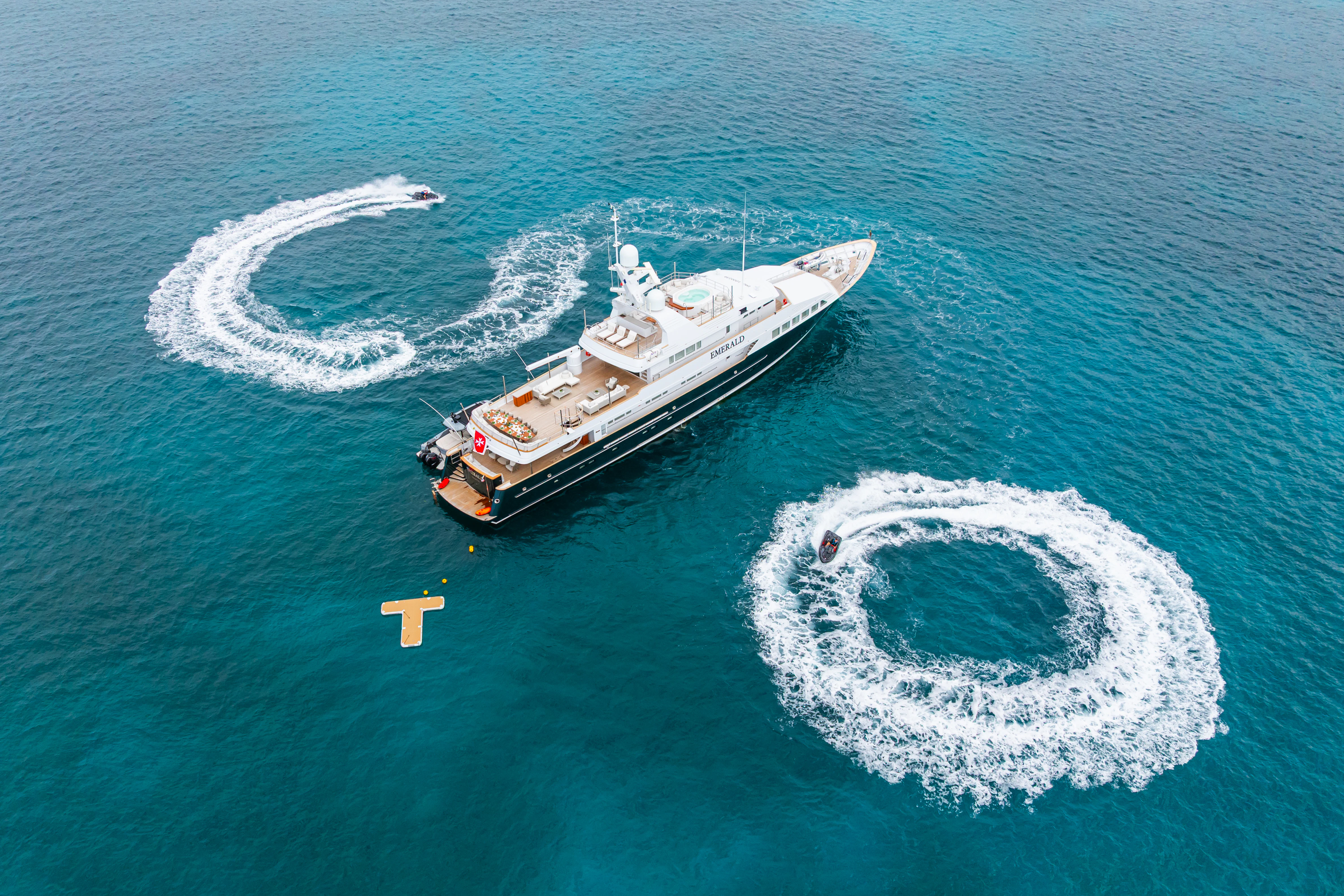 a space shuttle above a planet aboard EMERALD Yacht for Charter
