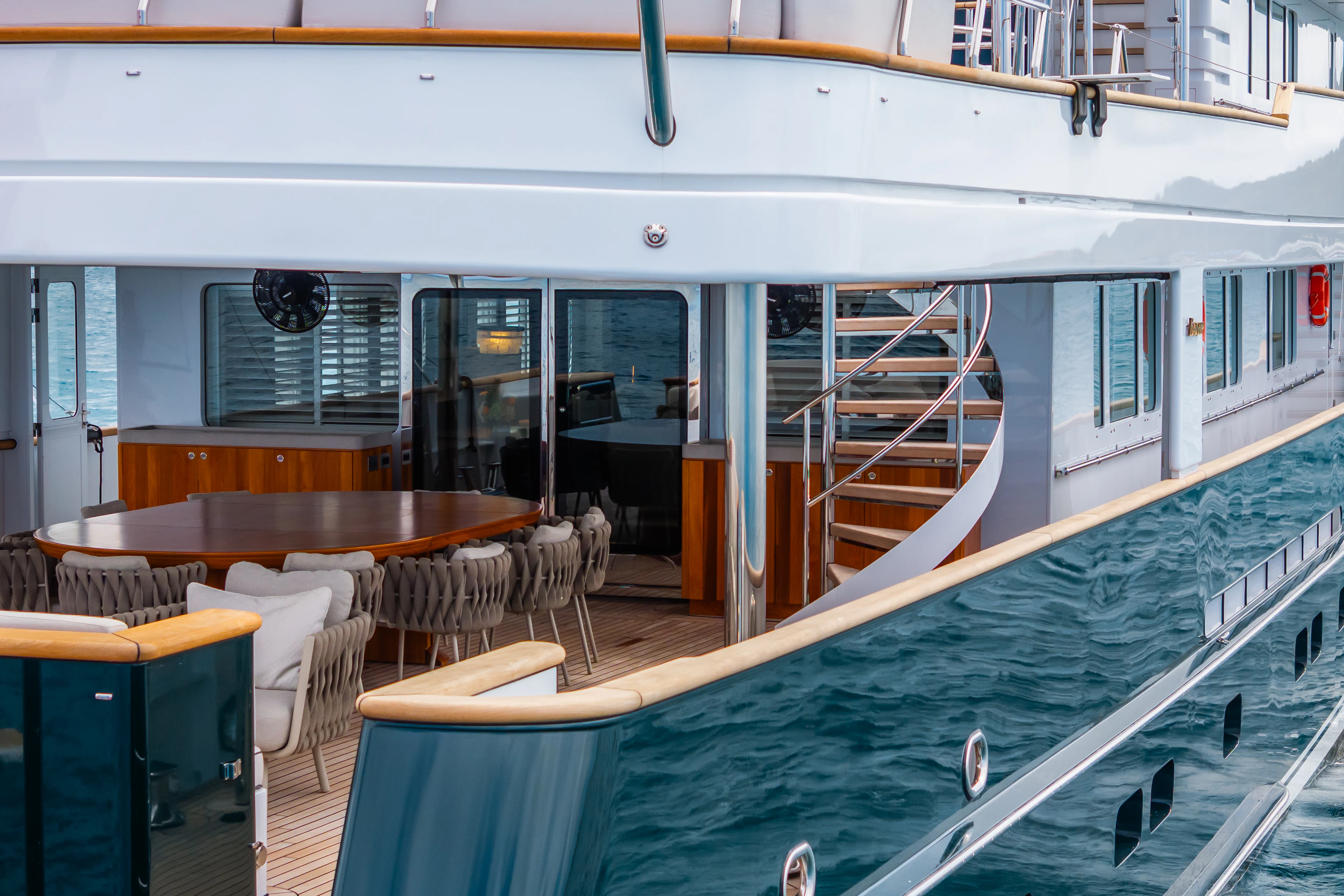 a boat with tables and chairs aboard EMERALD Yacht for Charter