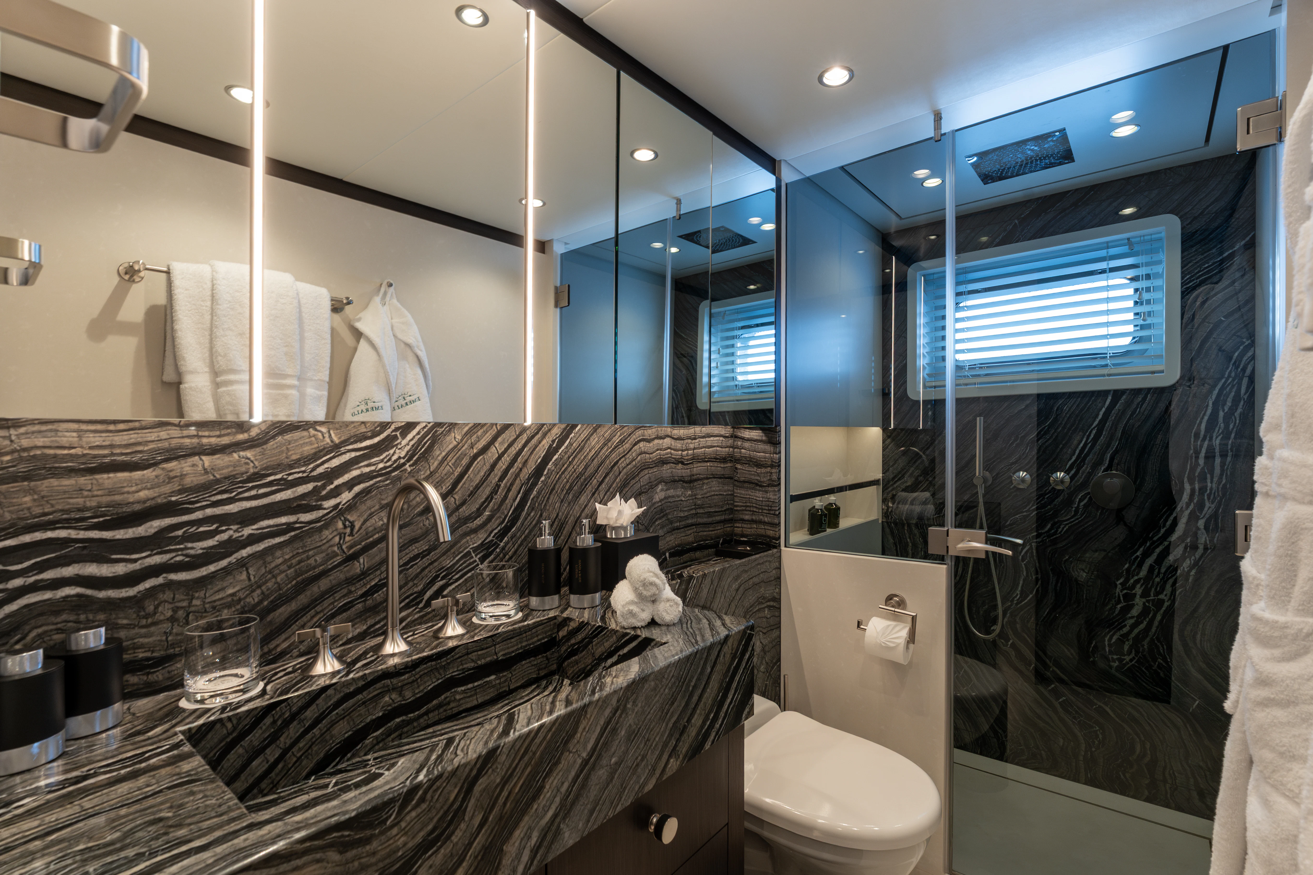 a bathroom with a large mirror aboard EMERALD Yacht for Charter