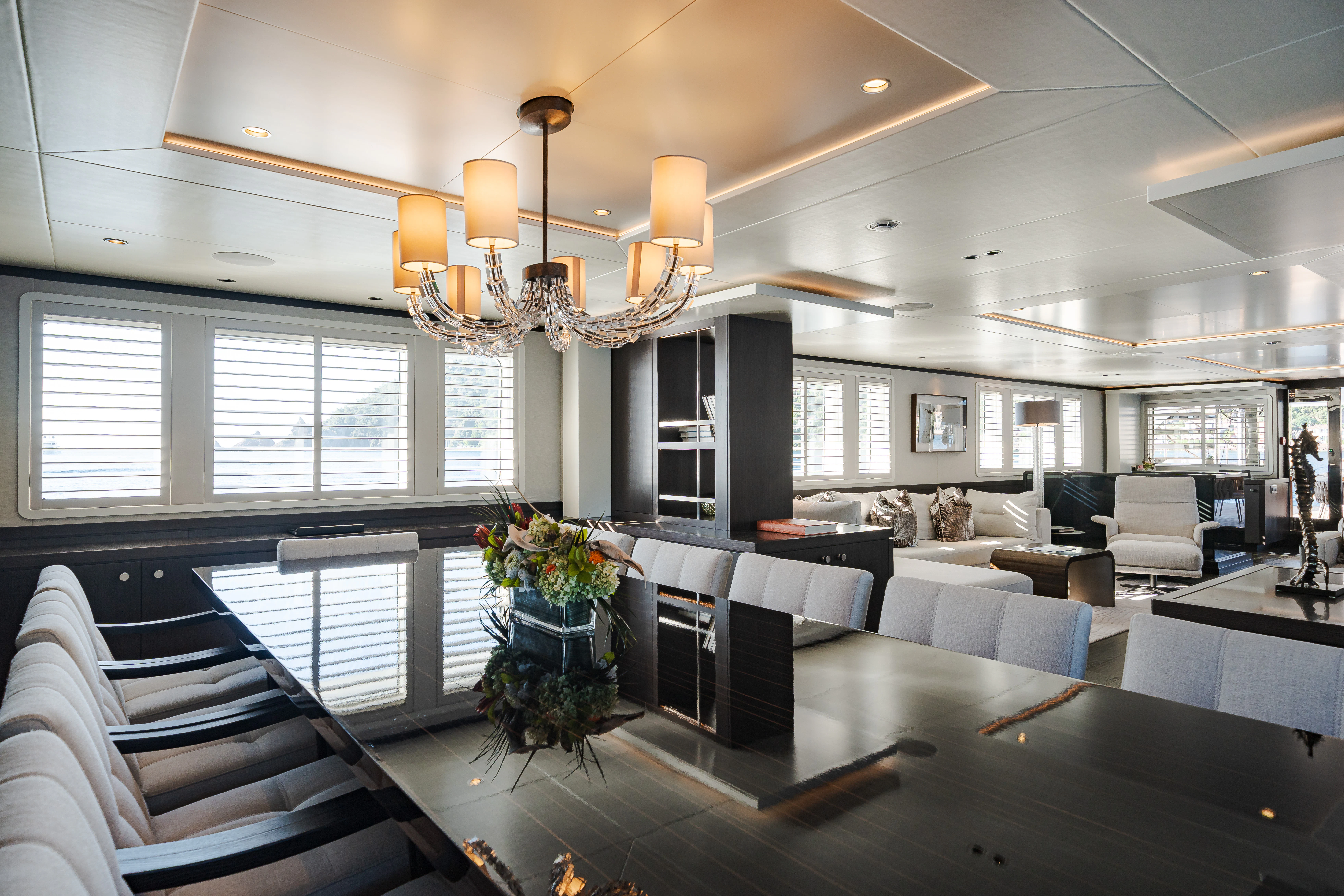 a large room with a chandelier and a large chandelier aboard EMERALD Yacht for Sale