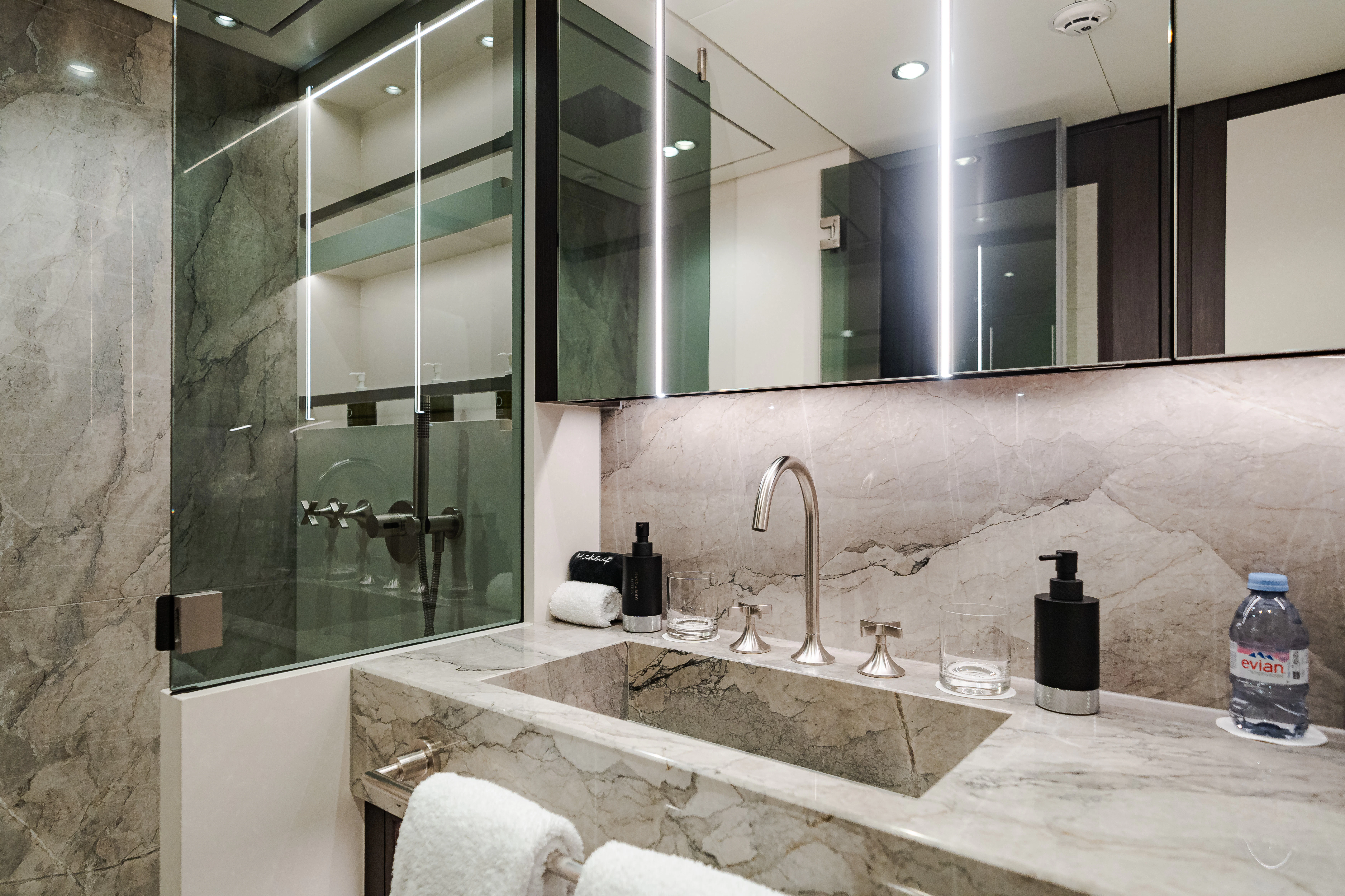 a bathroom with a large mirror aboard EMERALD Yacht for Sale