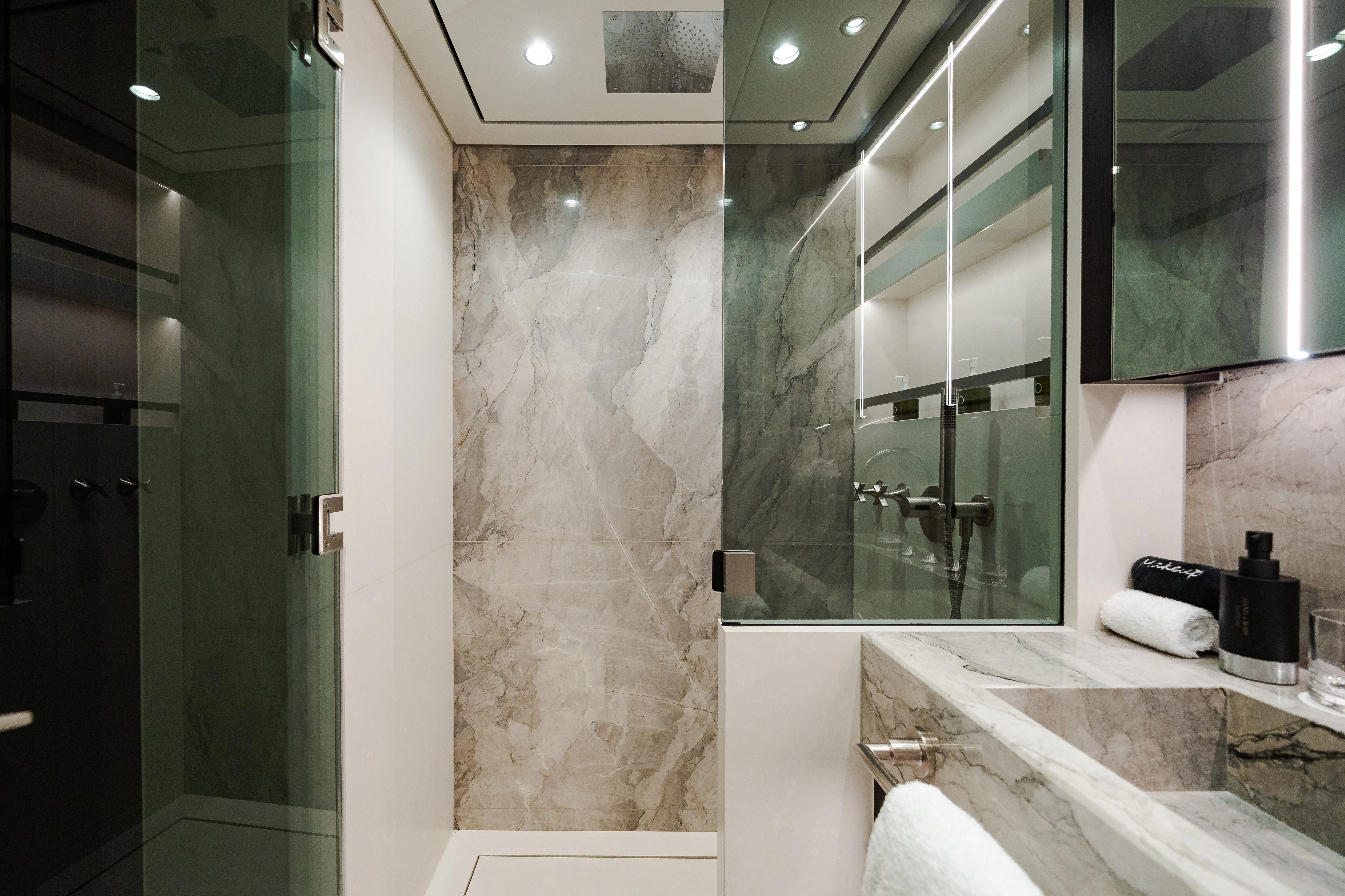 a bathroom with a glass shower aboard EMERALD Yacht for Sale