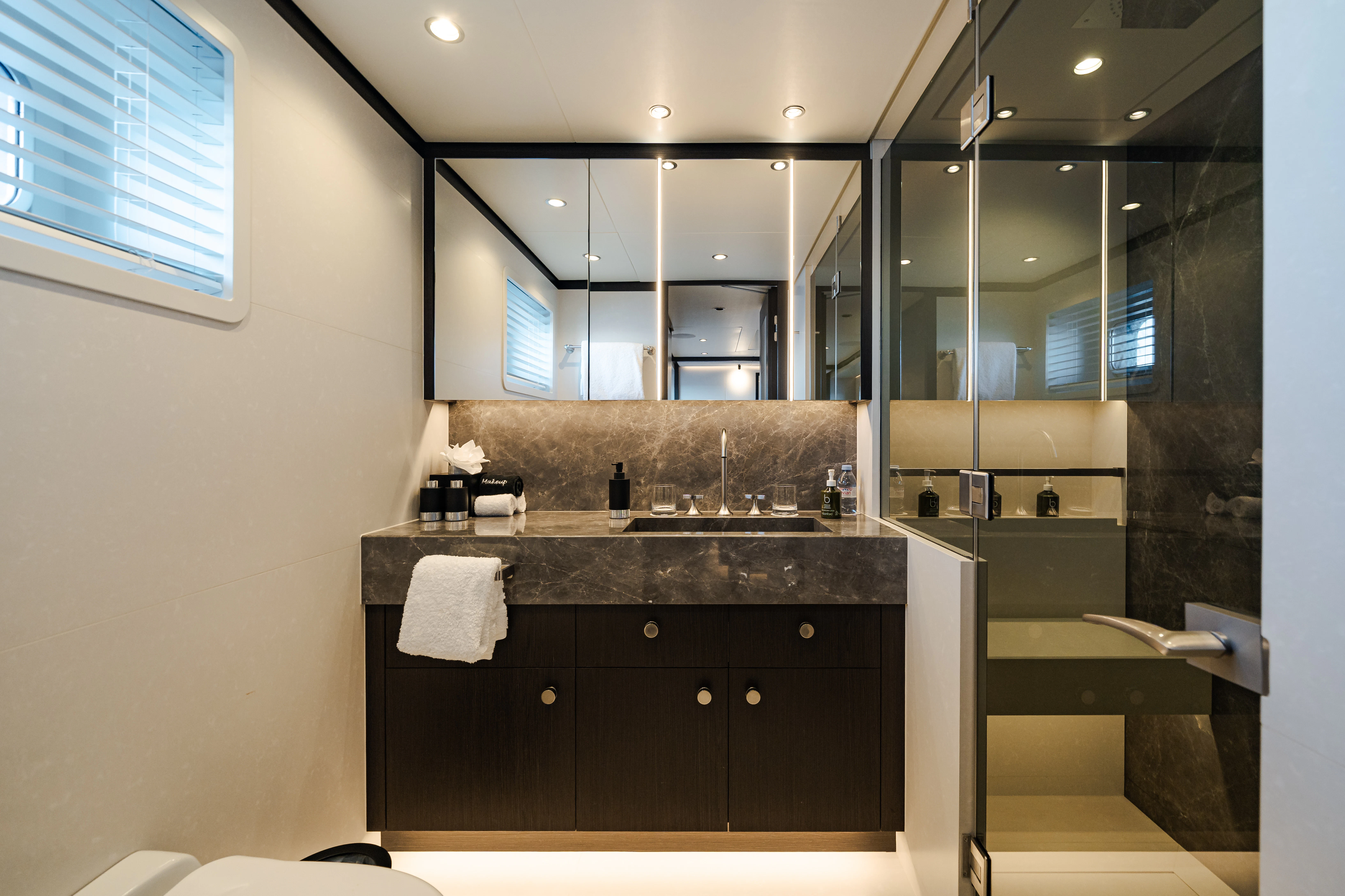 a bathroom with a large mirror aboard EMERALD Yacht for Sale