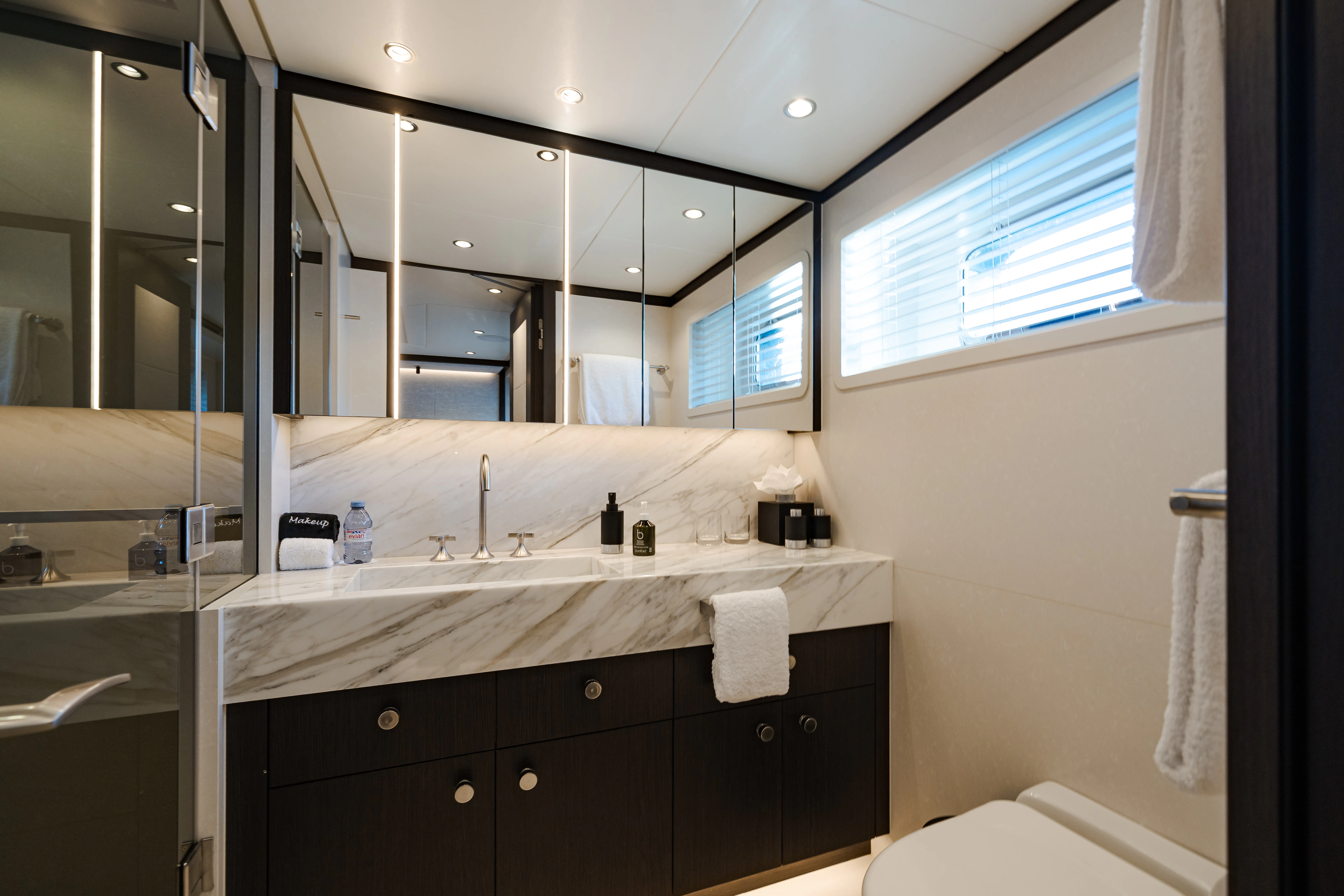 a bathroom with a large mirror aboard EMERALD Yacht for Sale