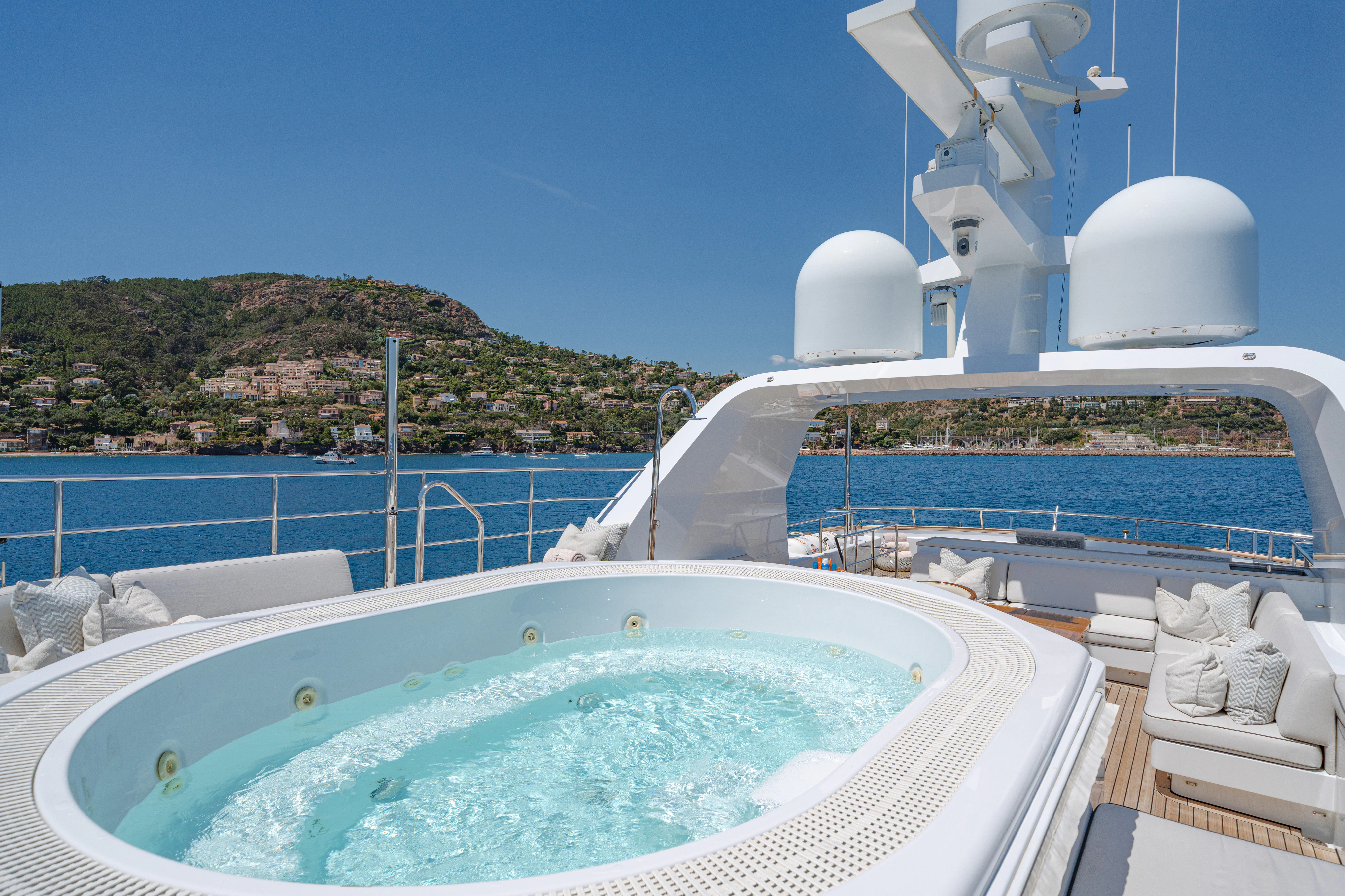 a swimming pool with a large white building and a large white dome on the roof aboard EMERALD Yacht for Sale
