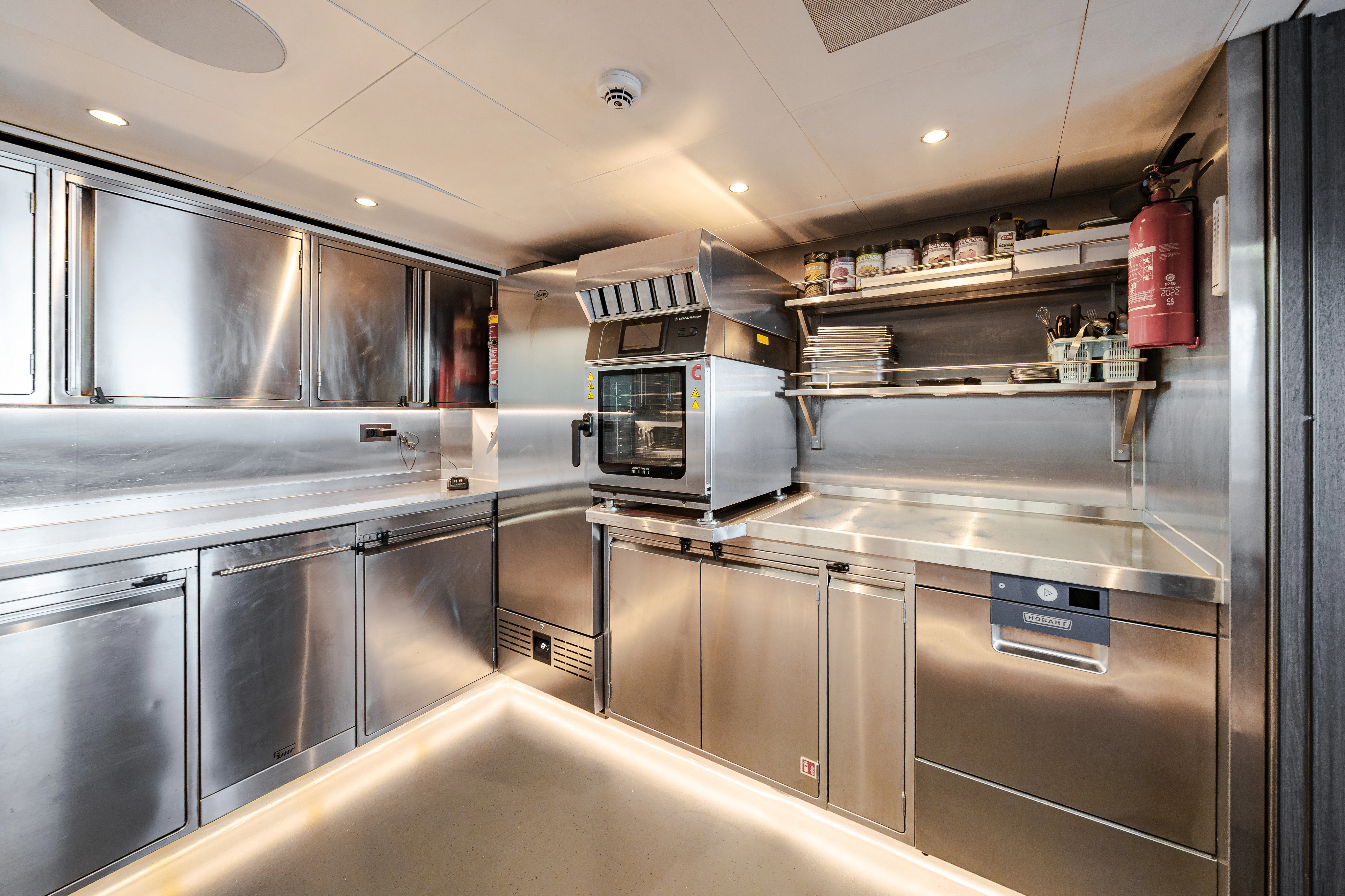 a kitchen with stainless steel appliances aboard EMERALD Yacht for Sale