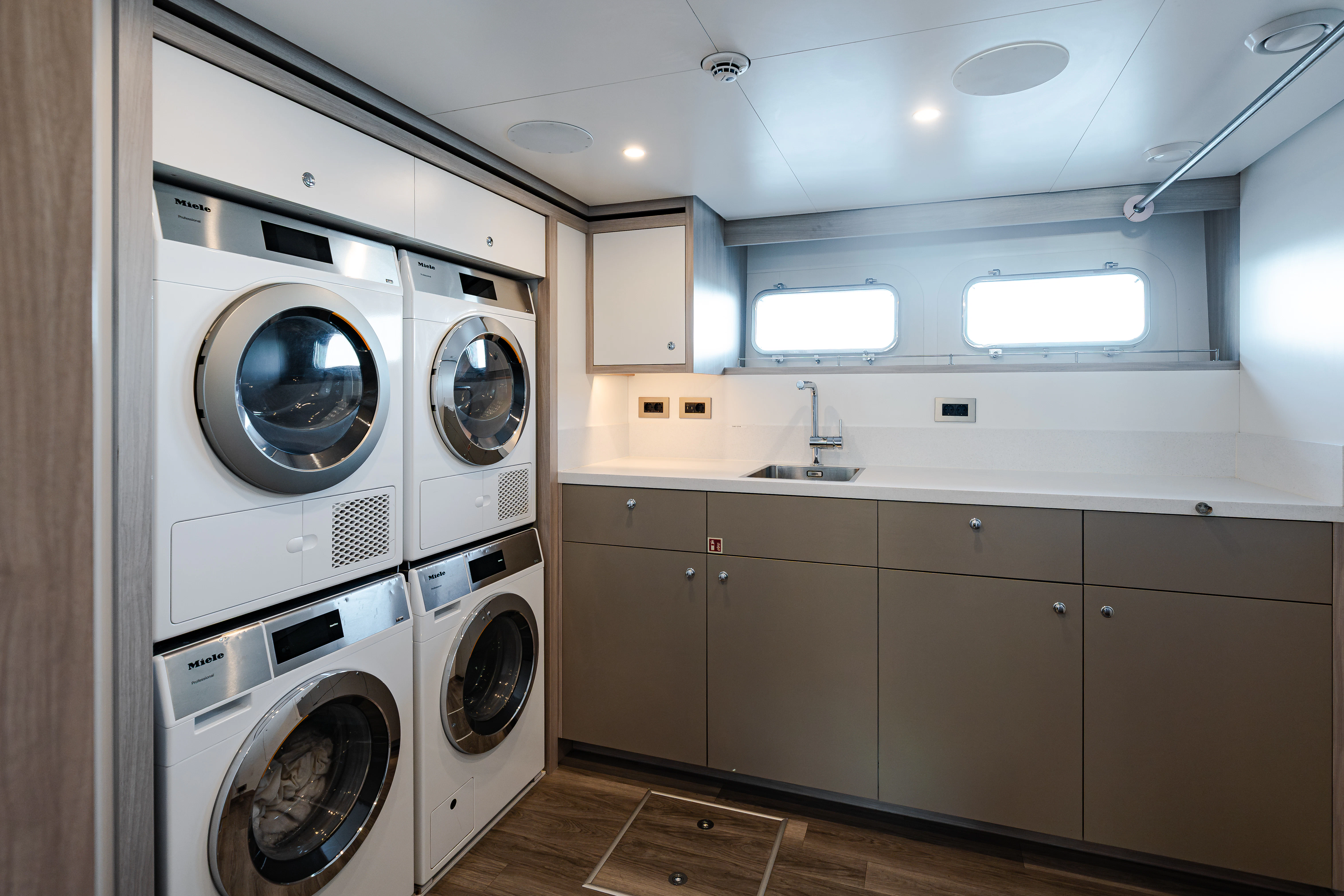 a washer and dryer in a room aboard EMERALD Yacht for Sale