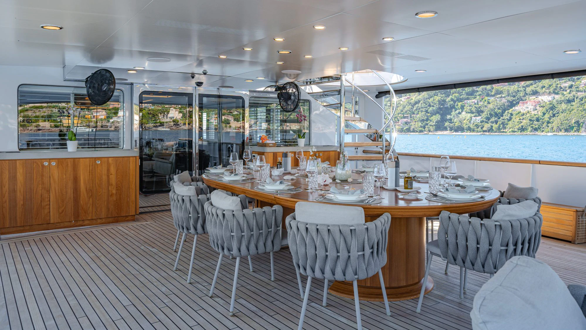 a large dining table in a room aboard EMERALD Yacht for Charter