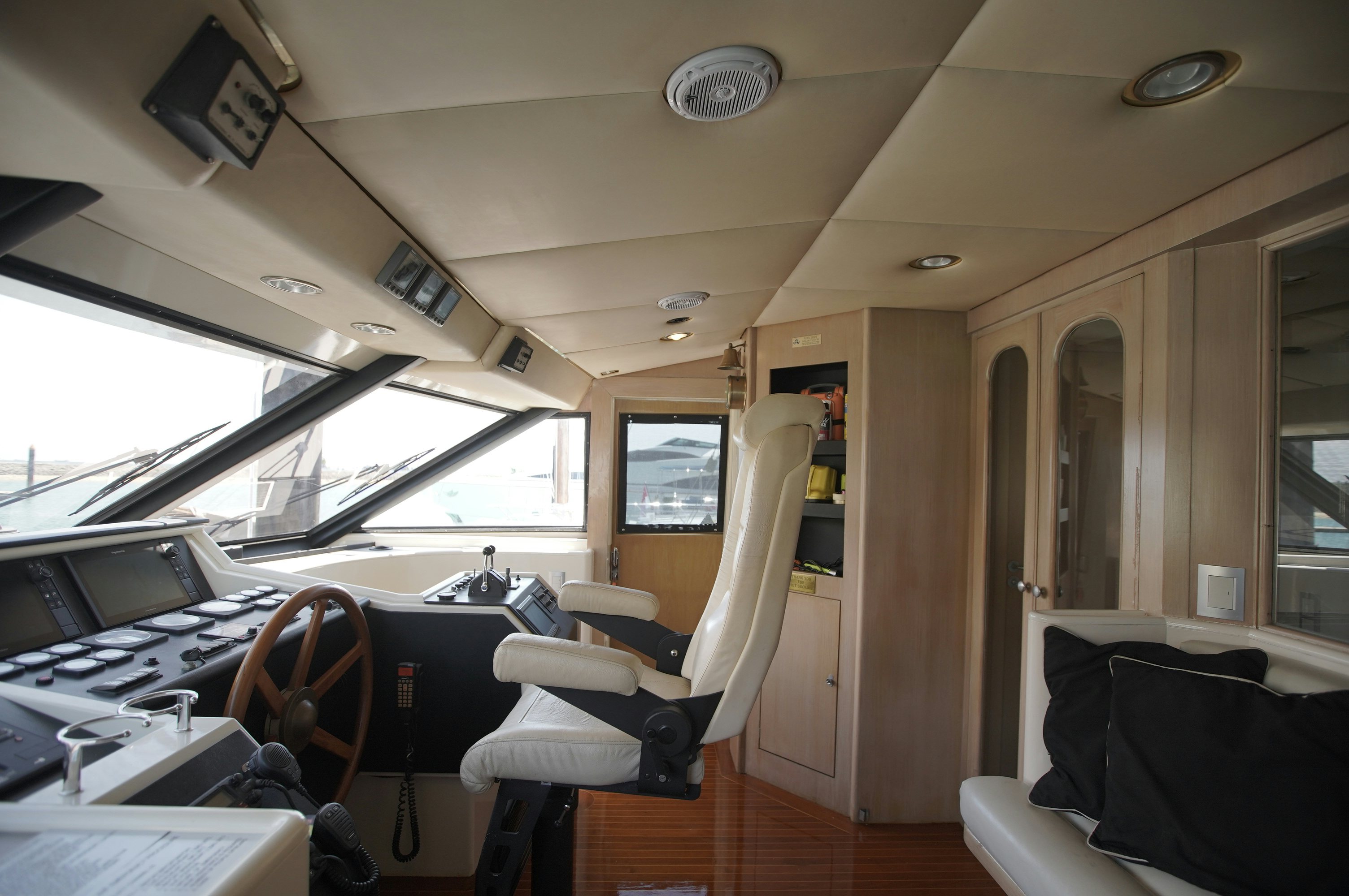 a room with a couple of seats and a desk with computers aboard BRAVEHEART 2 Yacht for Sale