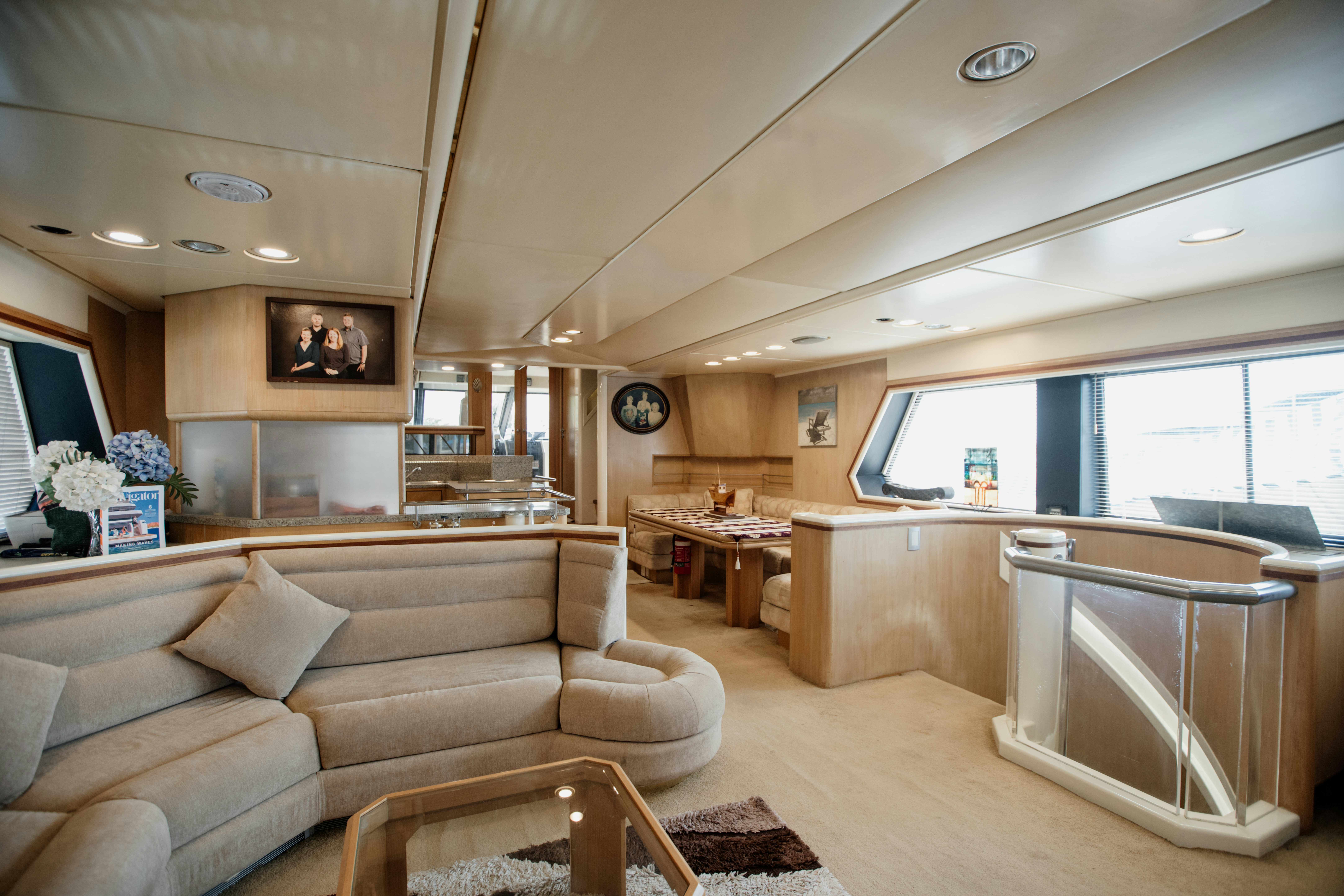 a living room with a couch and a table aboard BRAVEHEART 2 Yacht for Sale