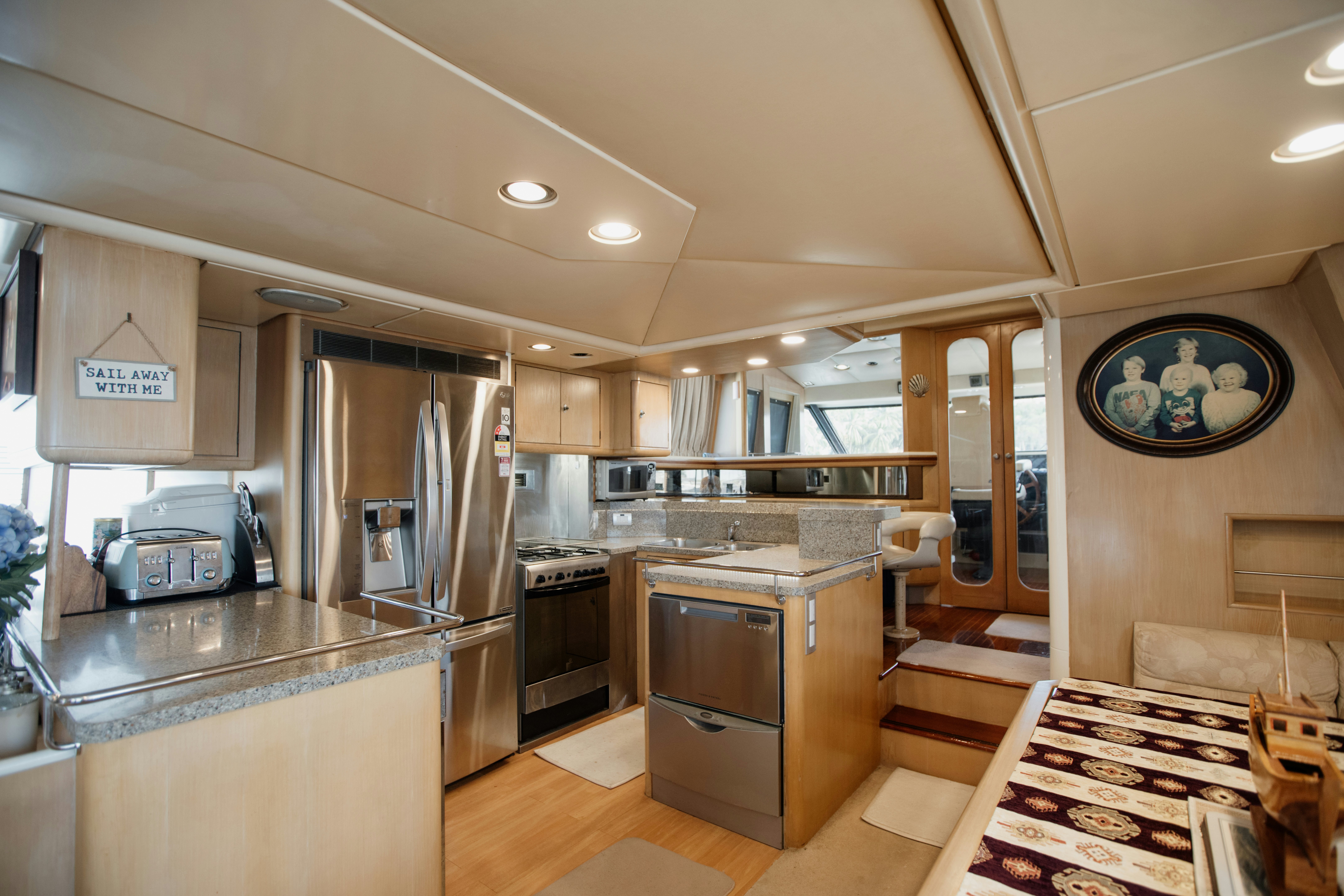 a kitchen with a dining table aboard BRAVEHEART 2 Yacht for Sale