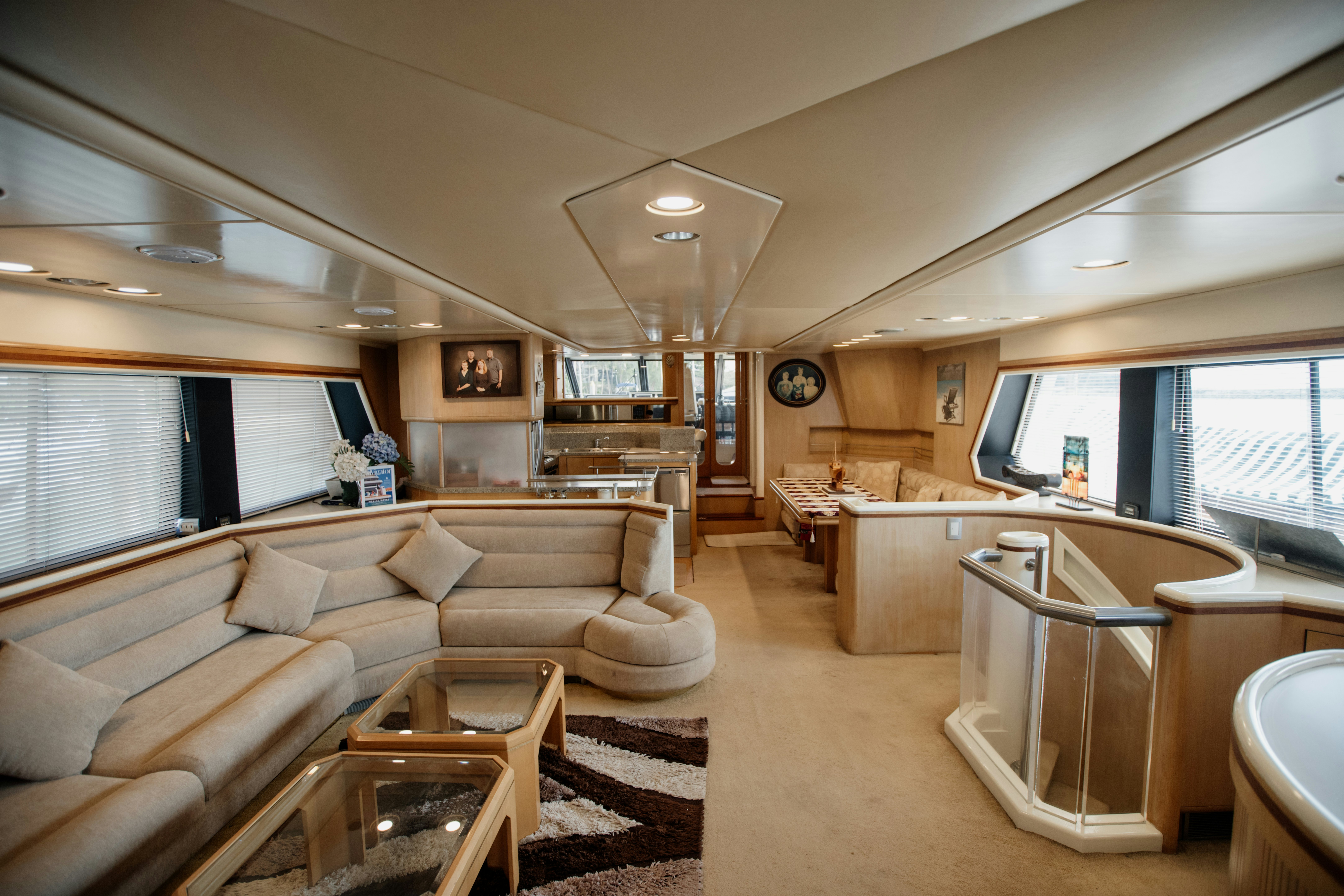 a large living room with a large window aboard BRAVEHEART 2 Yacht for Sale