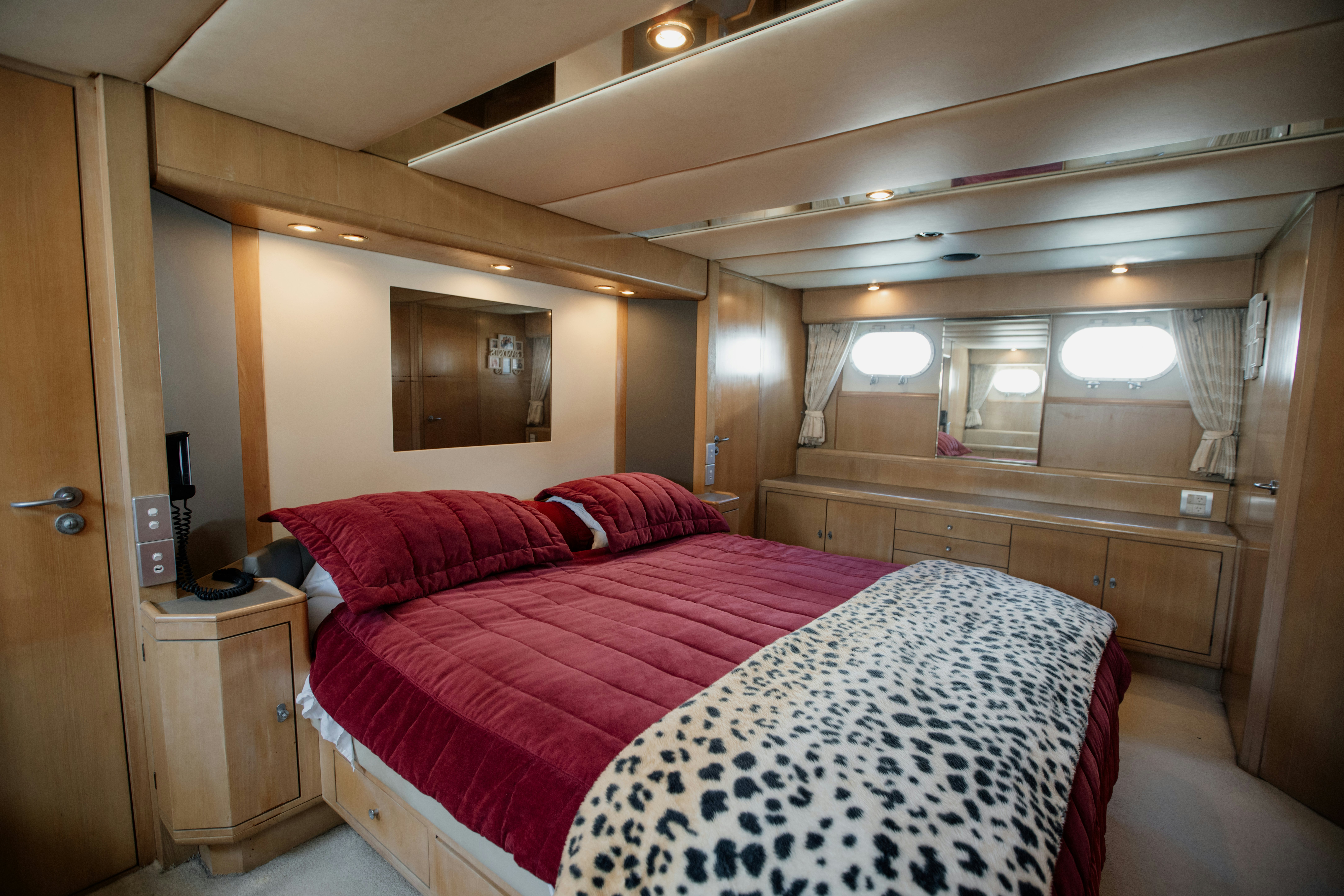 a room with a bed and a desk aboard BRAVEHEART 2 Yacht for Sale