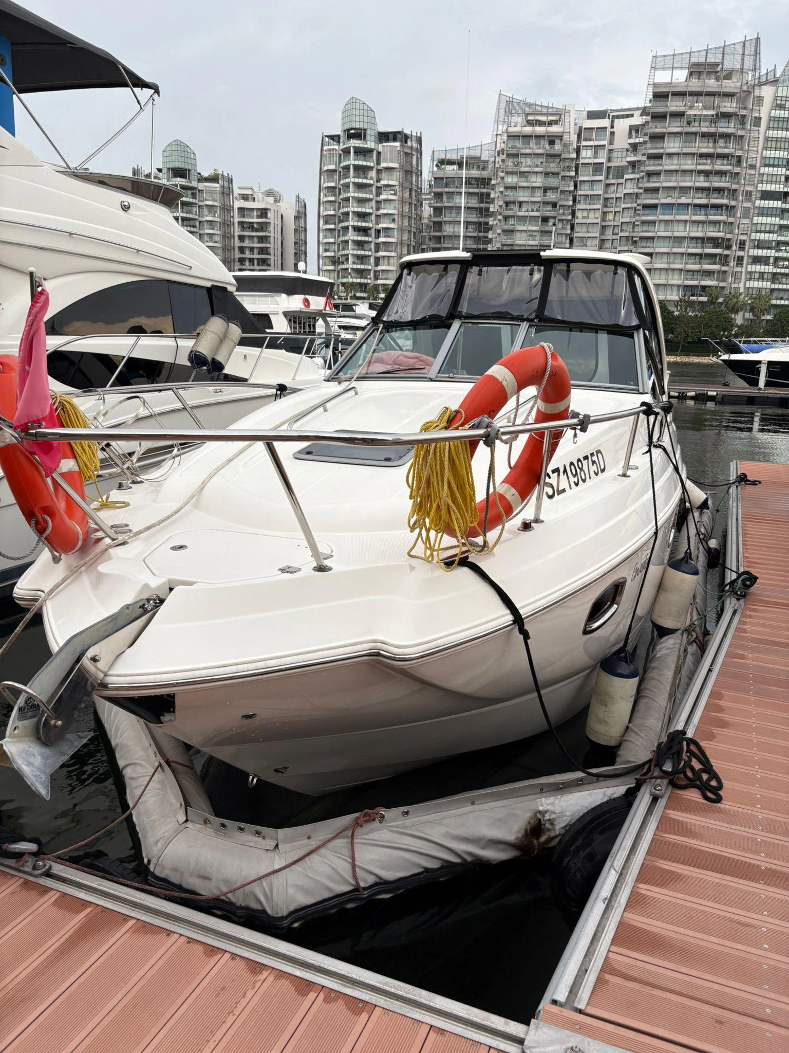 a boat with a sail on the deck aboard GNARALOO Yacht for Sale