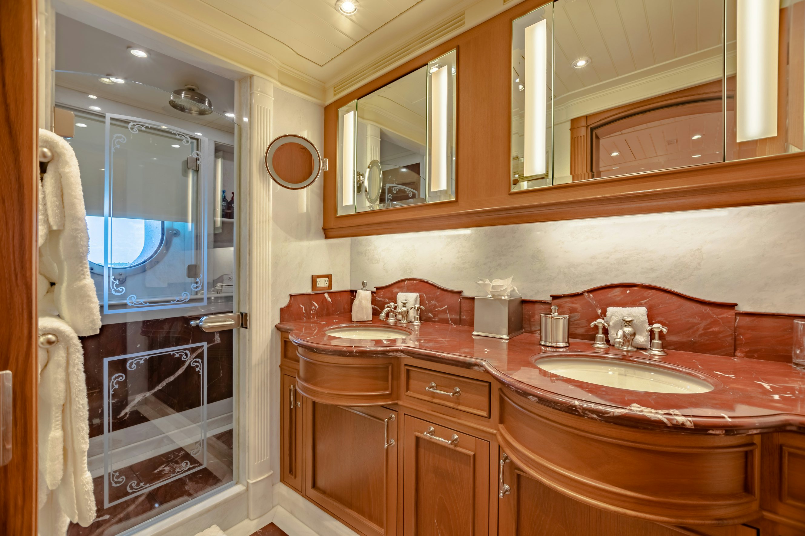 a bathroom with a large mirror aboard SHADOWL Yacht for Charter