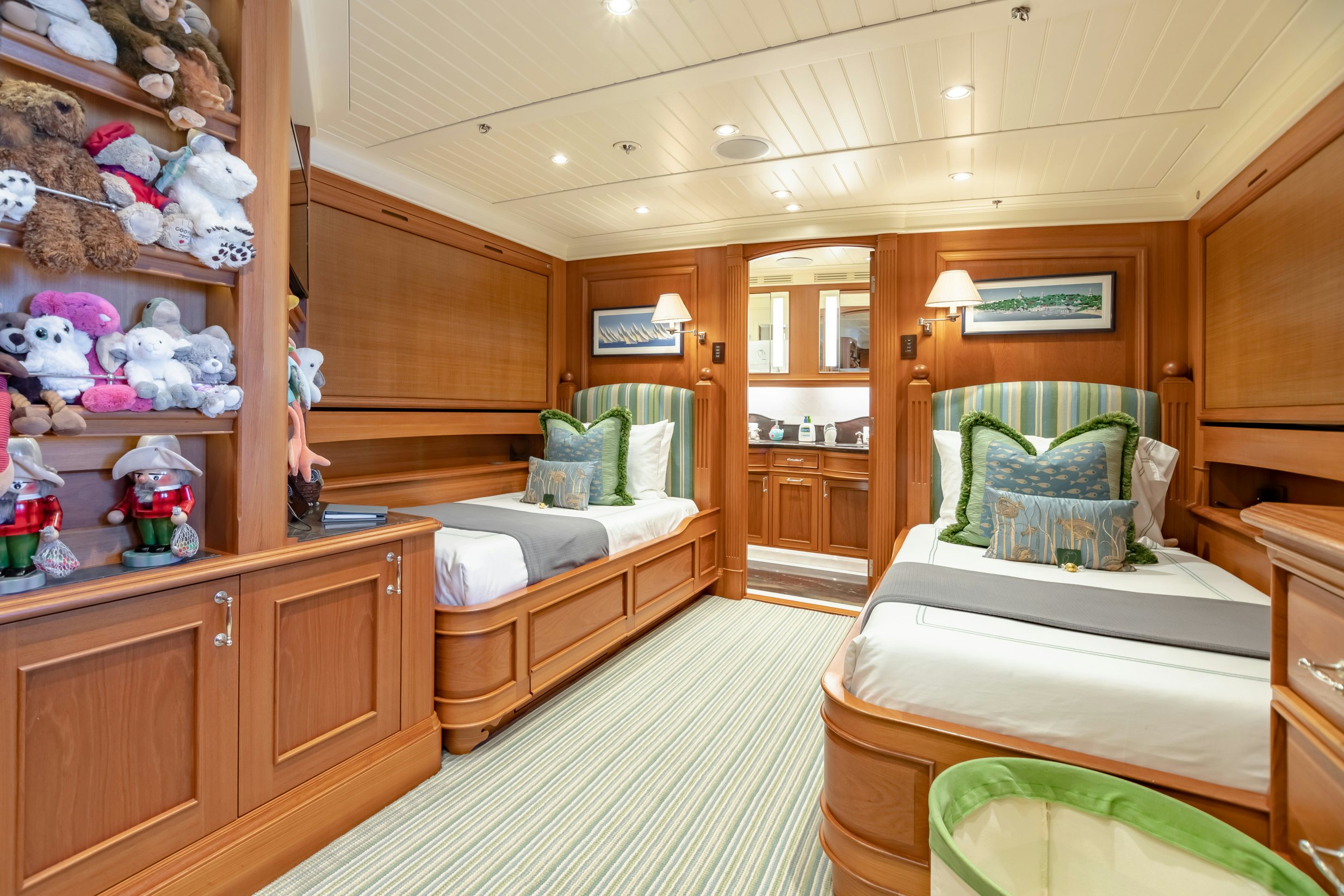 a bedroom with a bed and a chair aboard SHADOWL Yacht for Charter