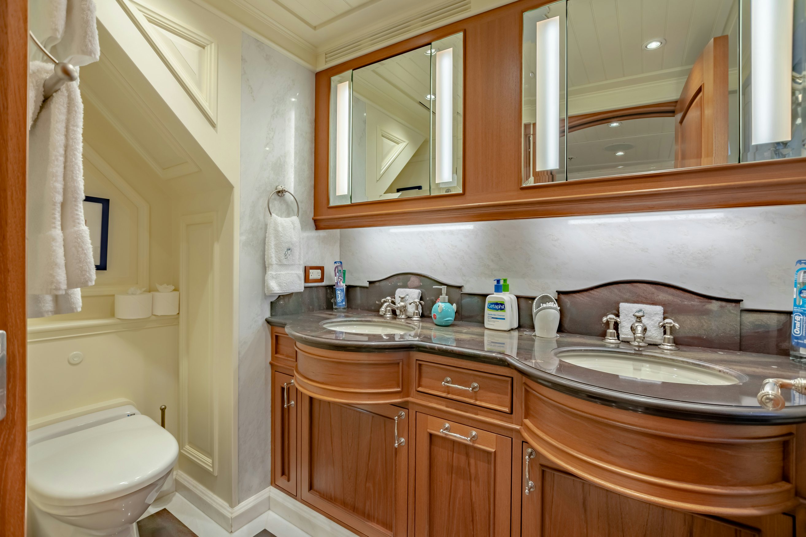 a bathroom with a sink and a mirror aboard SHADOWL Yacht for Charter