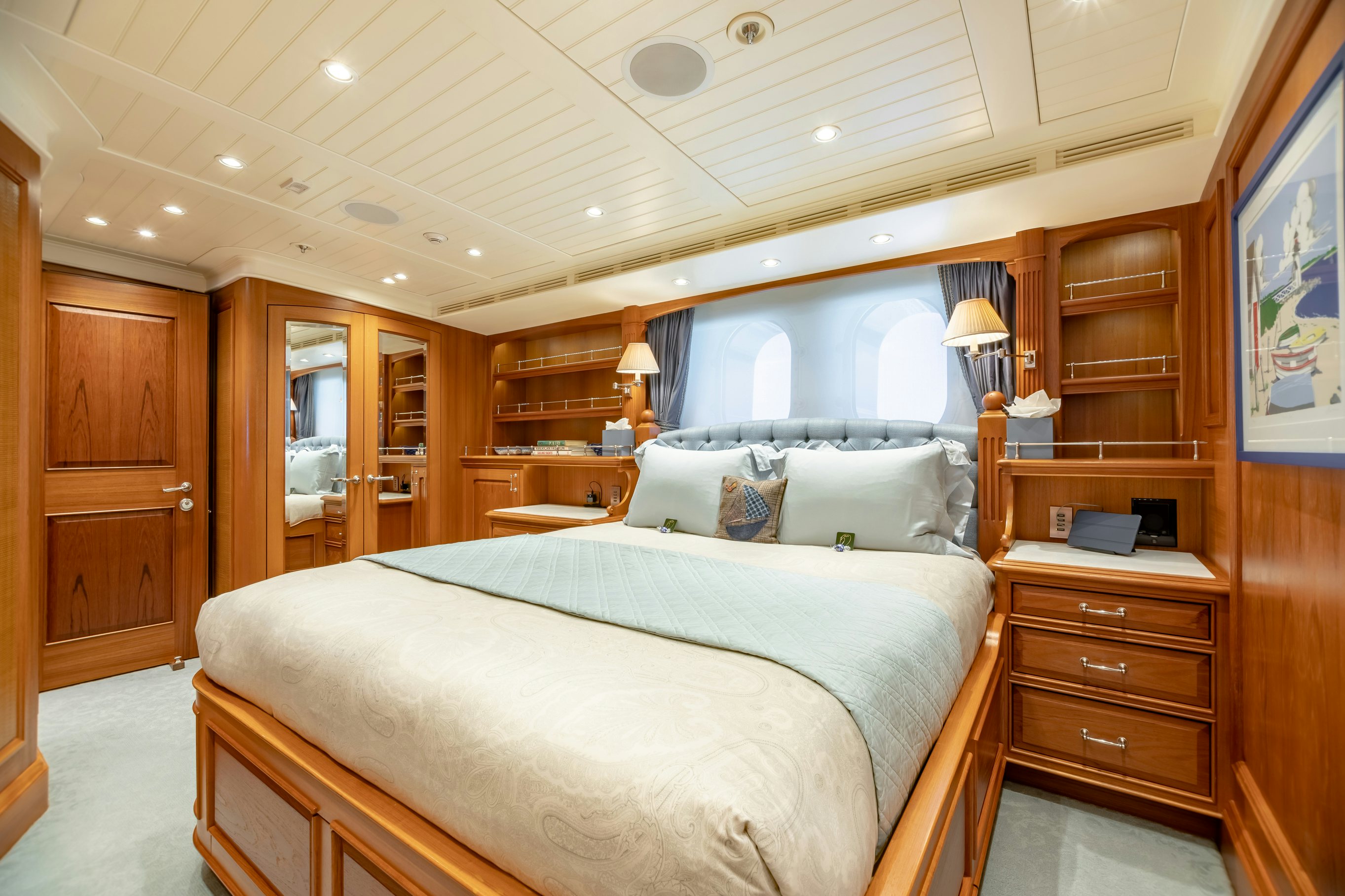 a bedroom with a large bed aboard SHADOWL Yacht for Charter