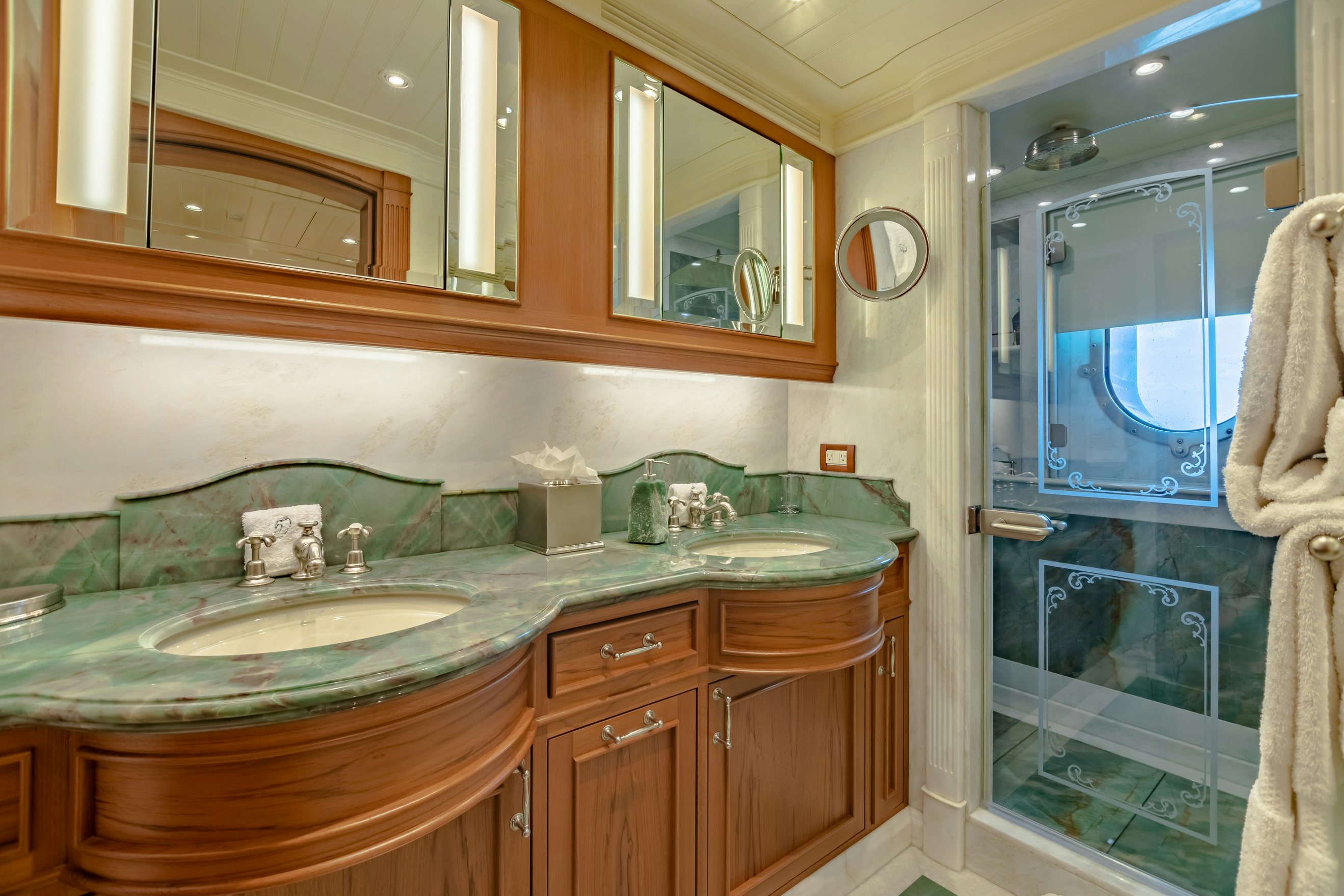 a bathroom with a large mirror aboard SHADOWL Yacht for Charter