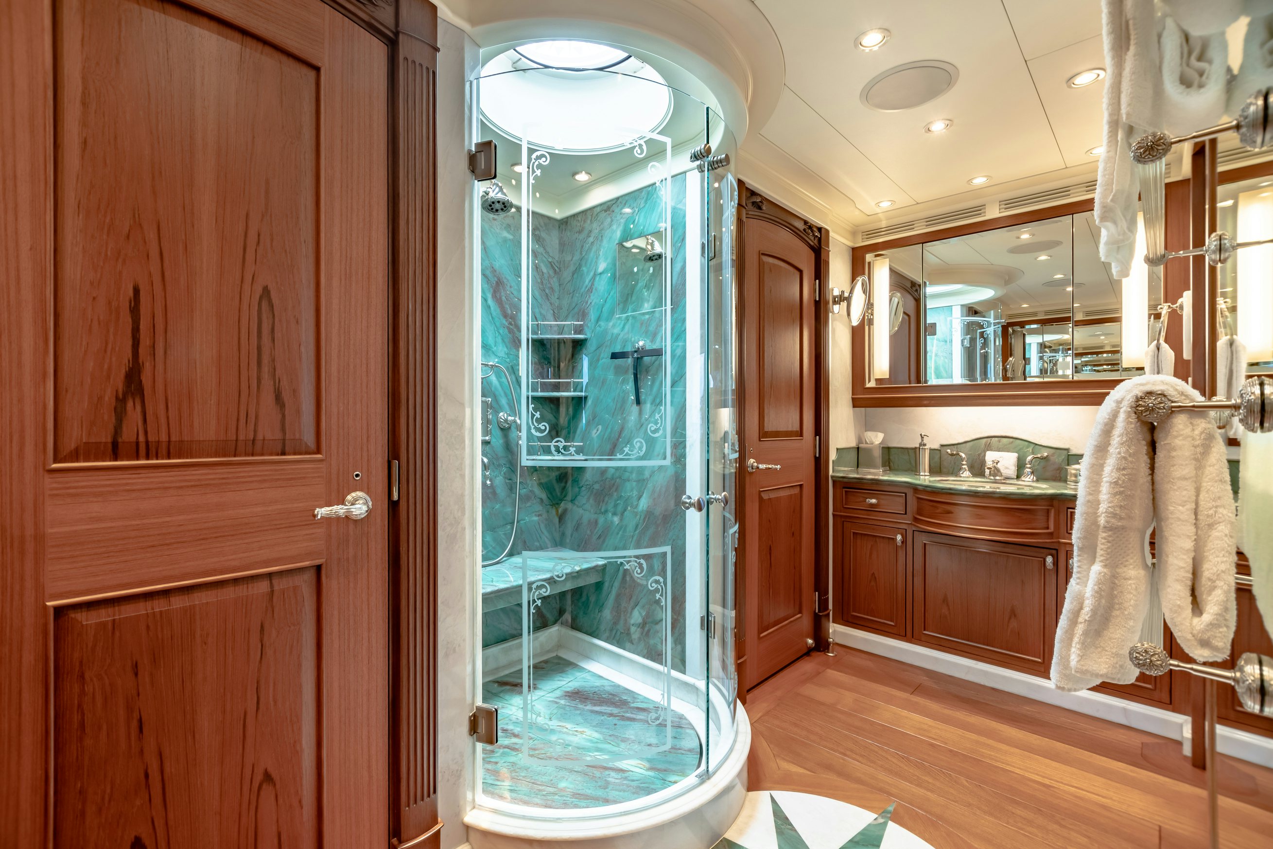 a bathroom with a glass shower aboard SHADOWL Yacht for Charter