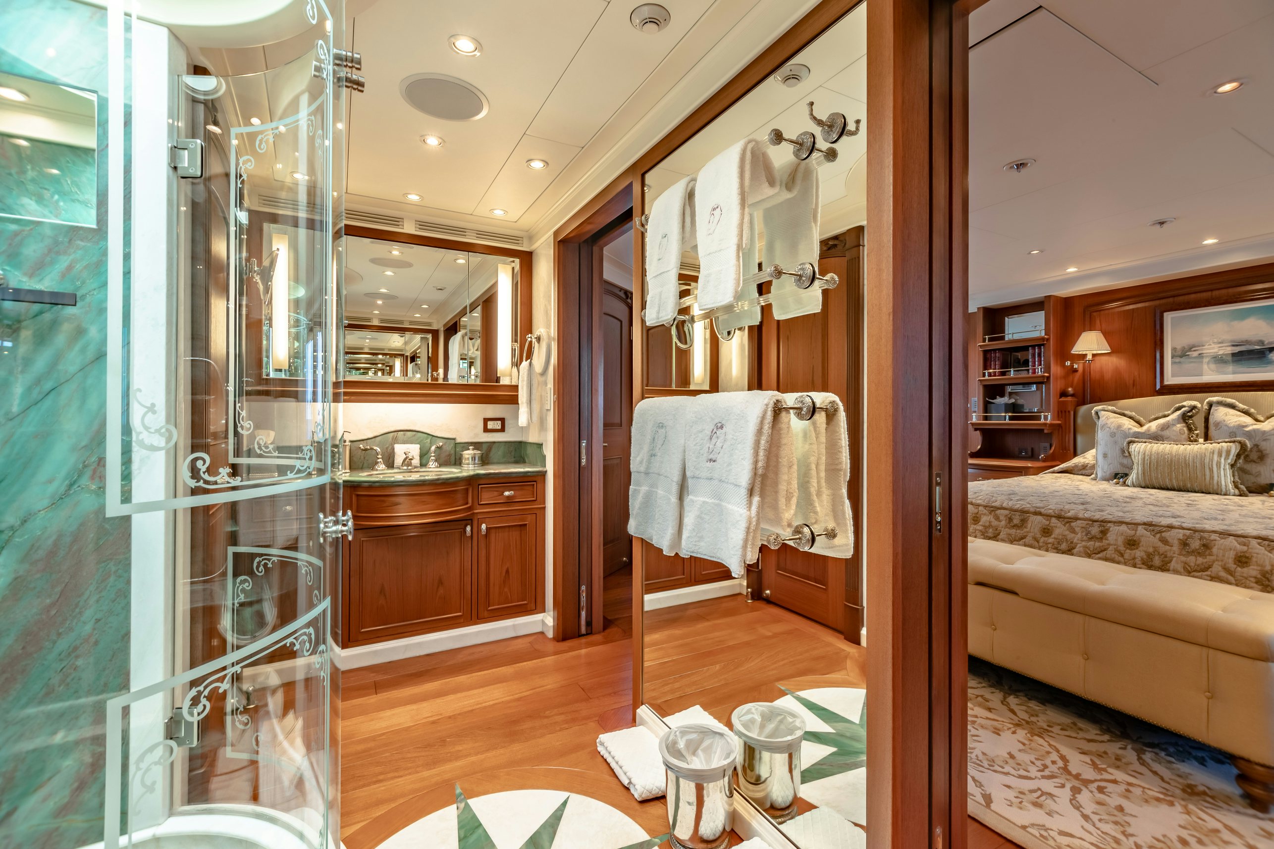 a bathroom with a glass shower aboard SHADOWL Yacht for Charter